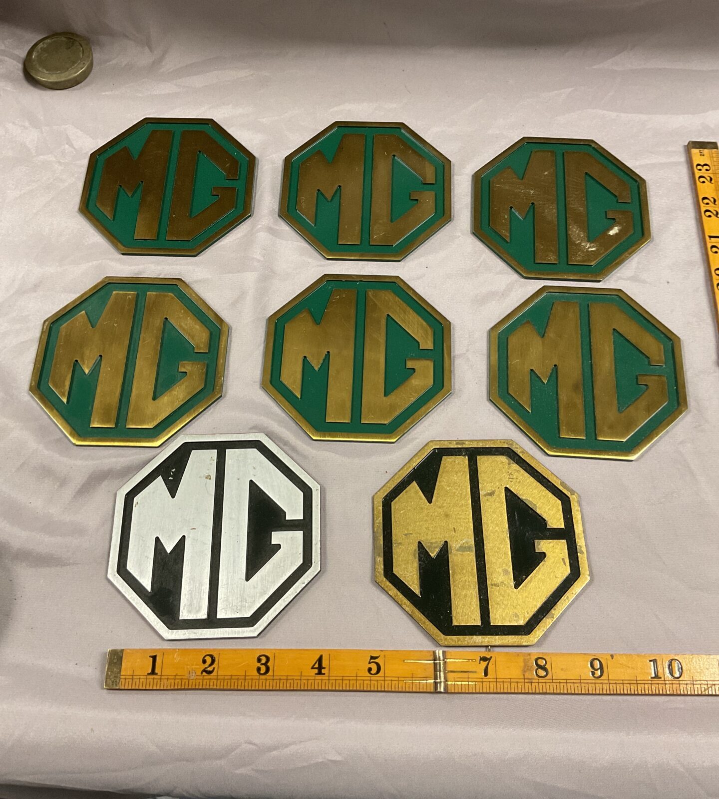 Collection of metal M G metal plaques Custom made locally