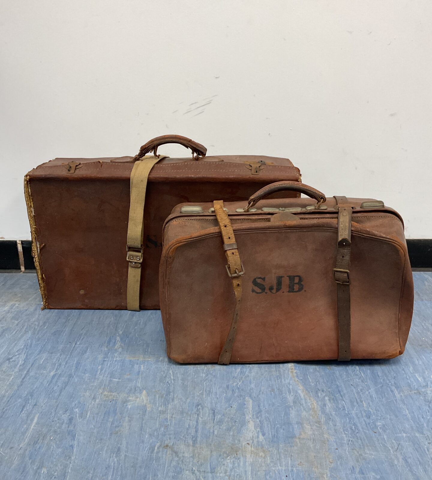 Two vintage leather travel cases initialed s j b