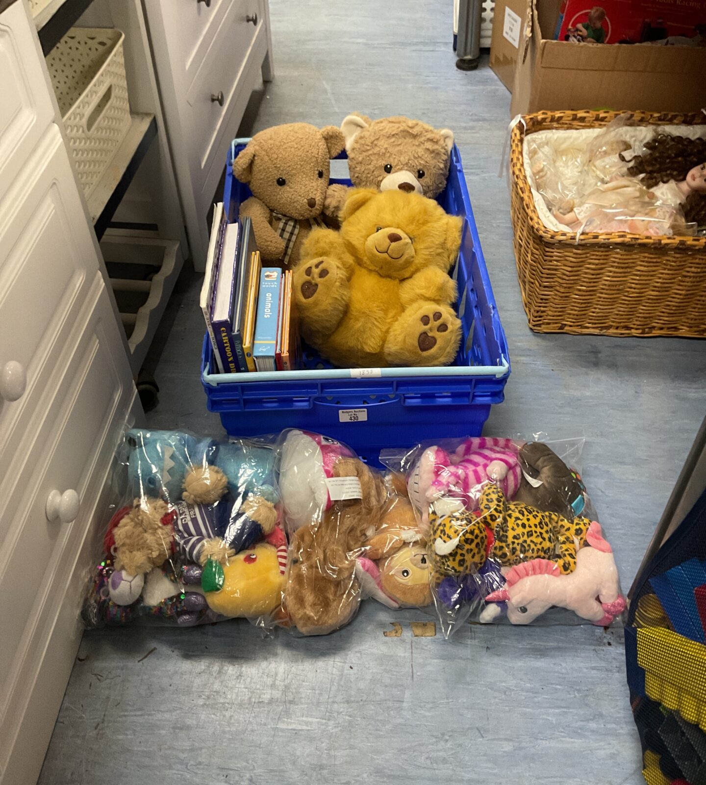 Tray of mixed items inc selection of soft teddy bears and animal books