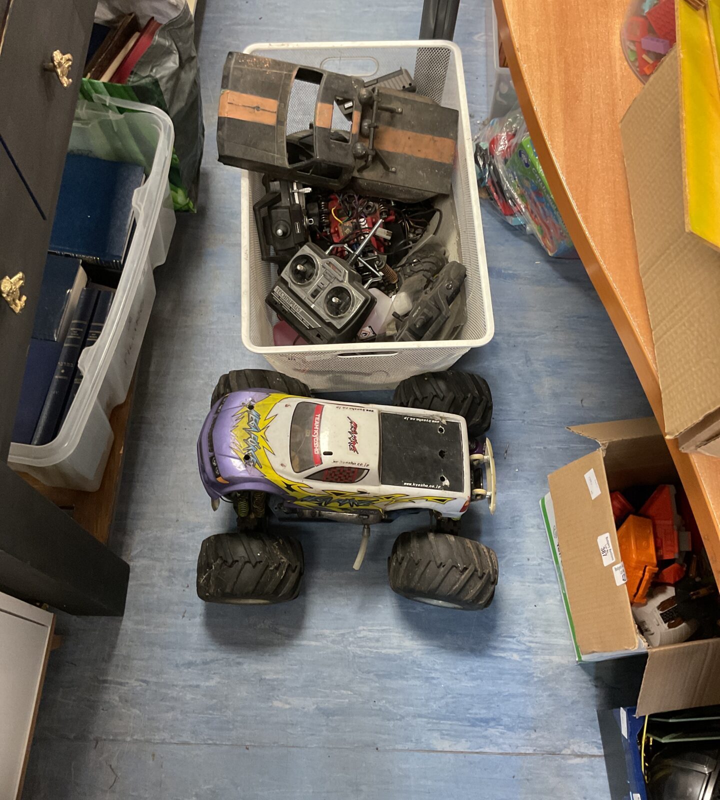 Box containing megaforce rc car with other mixed rc items