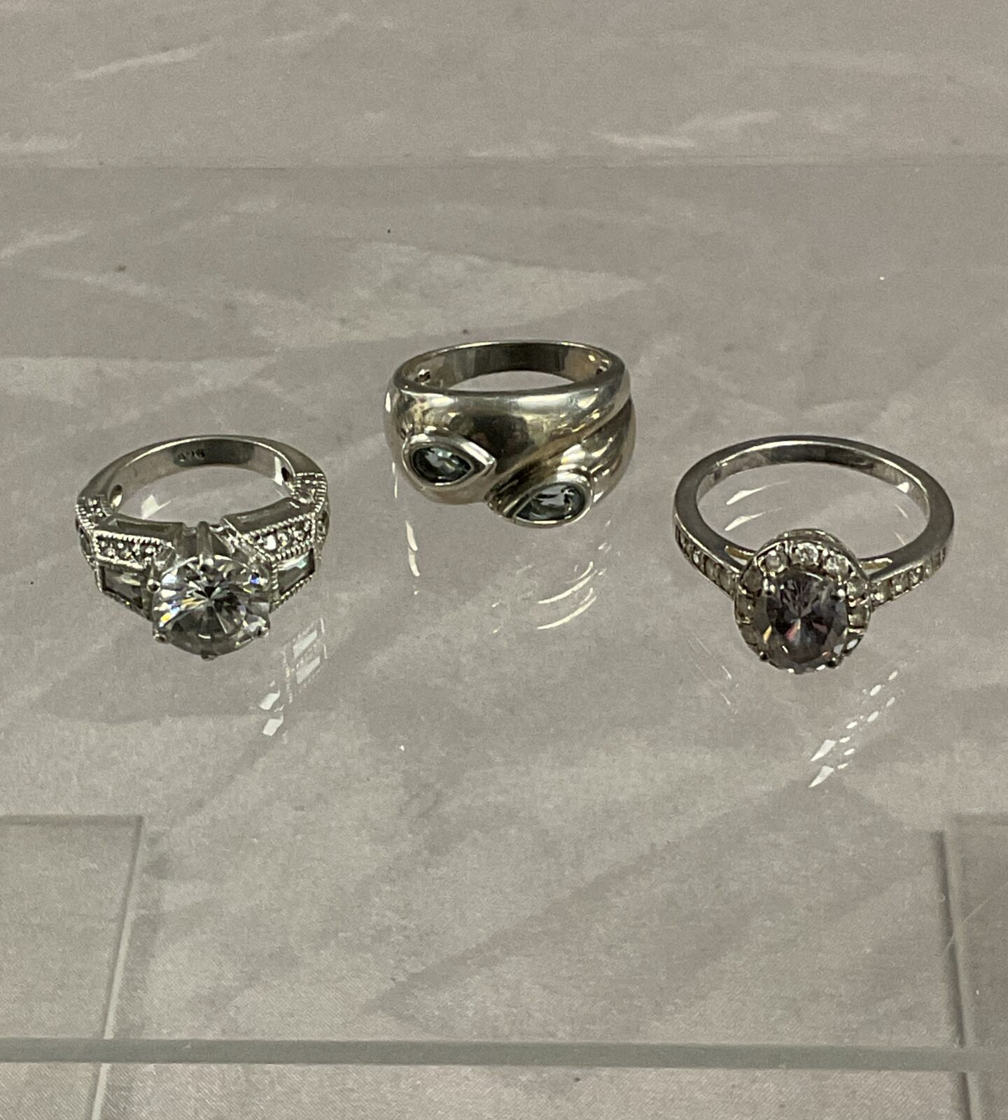 Three 925 silver stone set rings sizes h m q