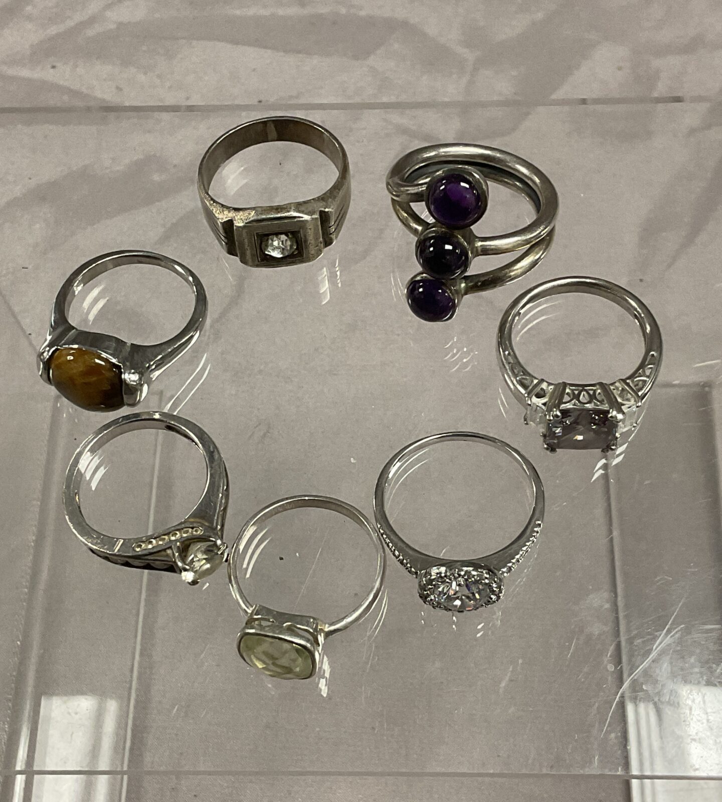 Seven silver and Whitemetal rings assorted sizes