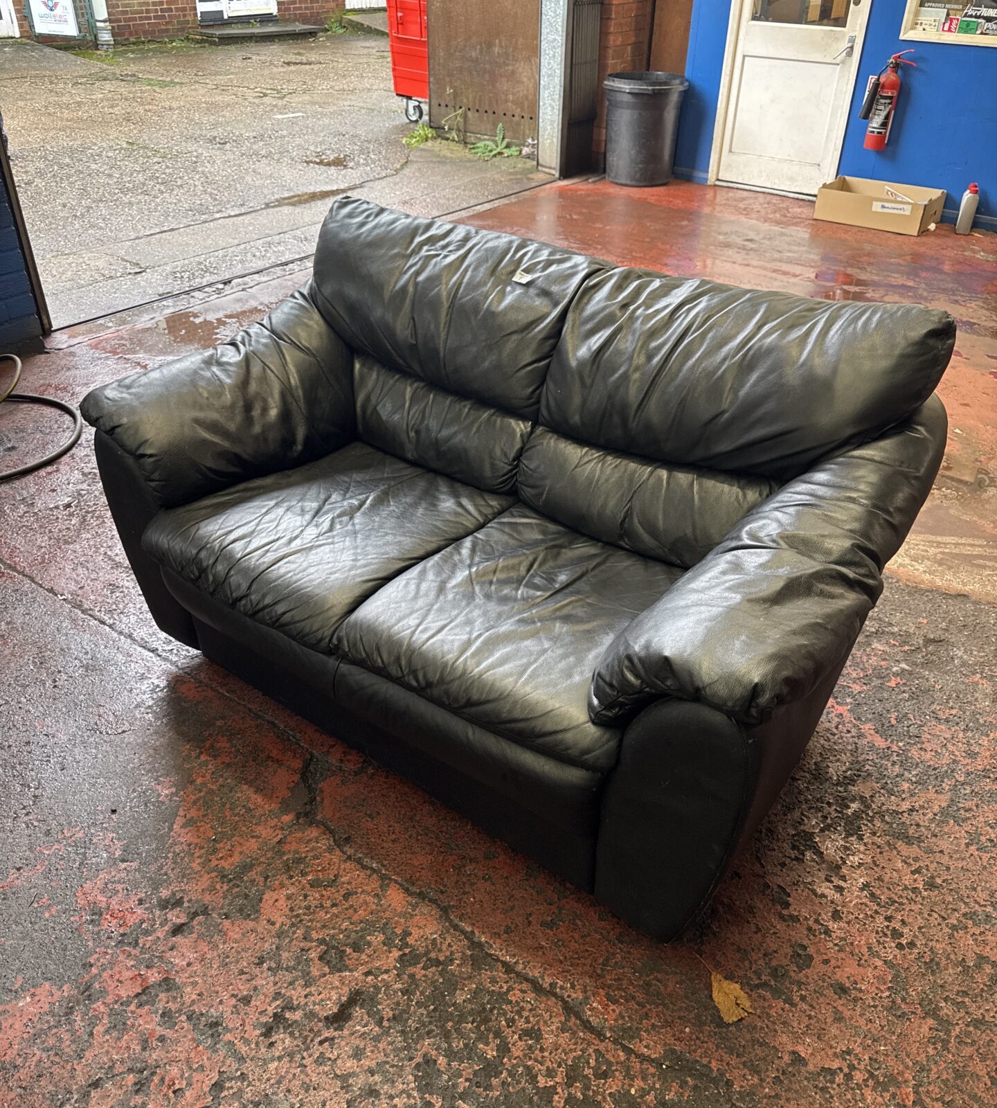 Leather two seater sofa - has some marks on rear