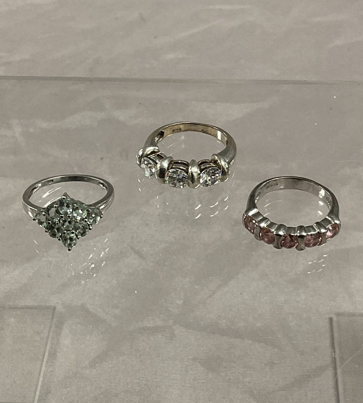 Three 925 Silver stone set rings sizes L M N