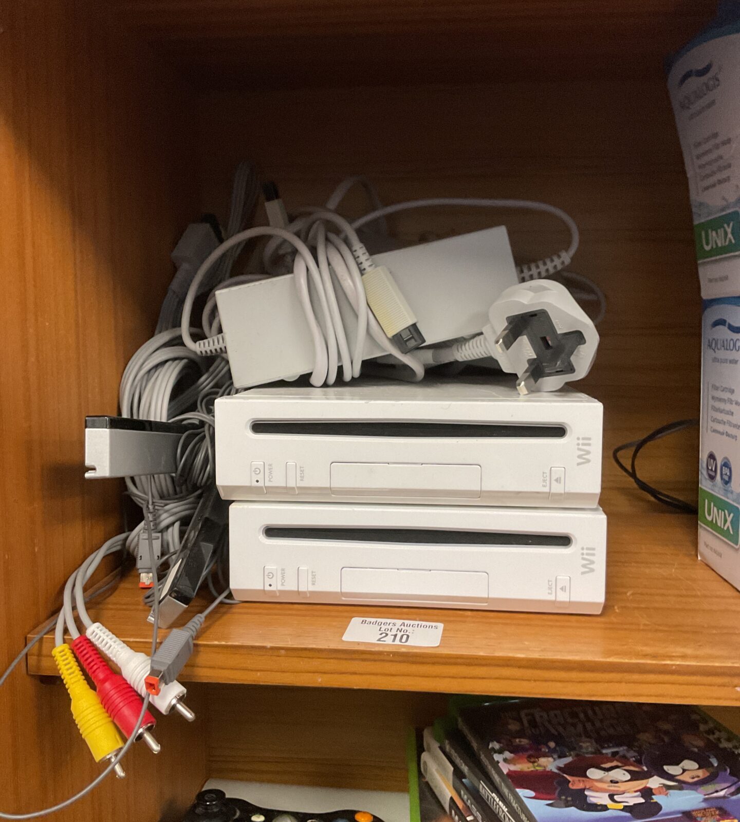 Two Nintendo wii consoles with cables