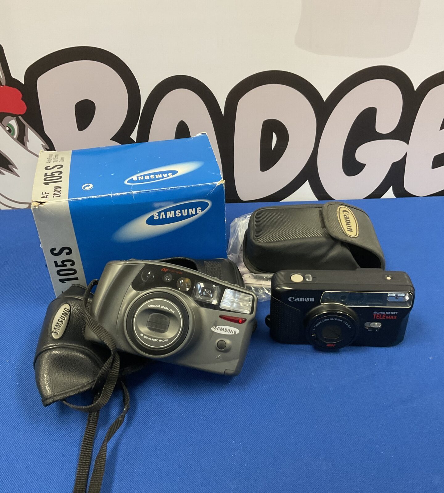 Two cameras including canon sure shot telemax & samsung zoom 105s