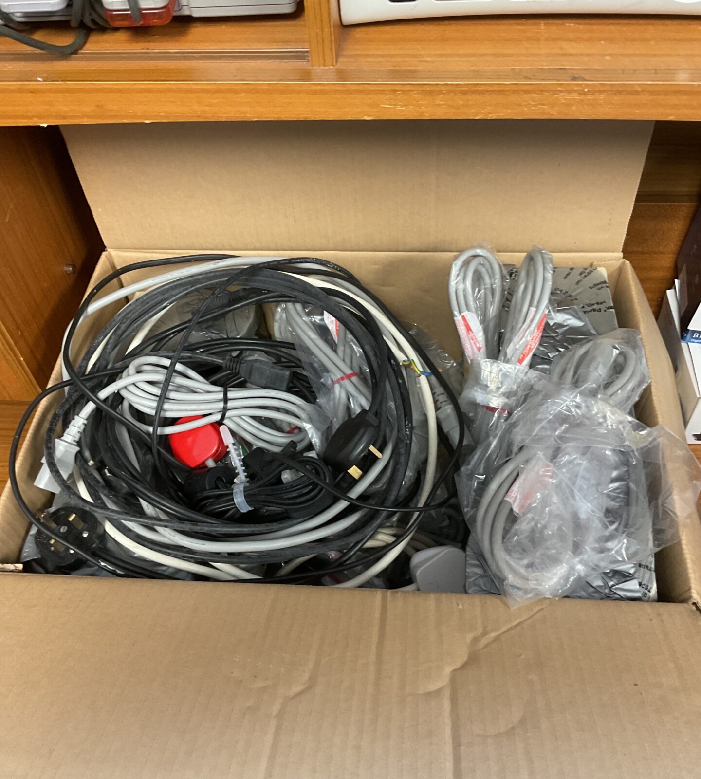 Large box of mixed cables including new kettle leads