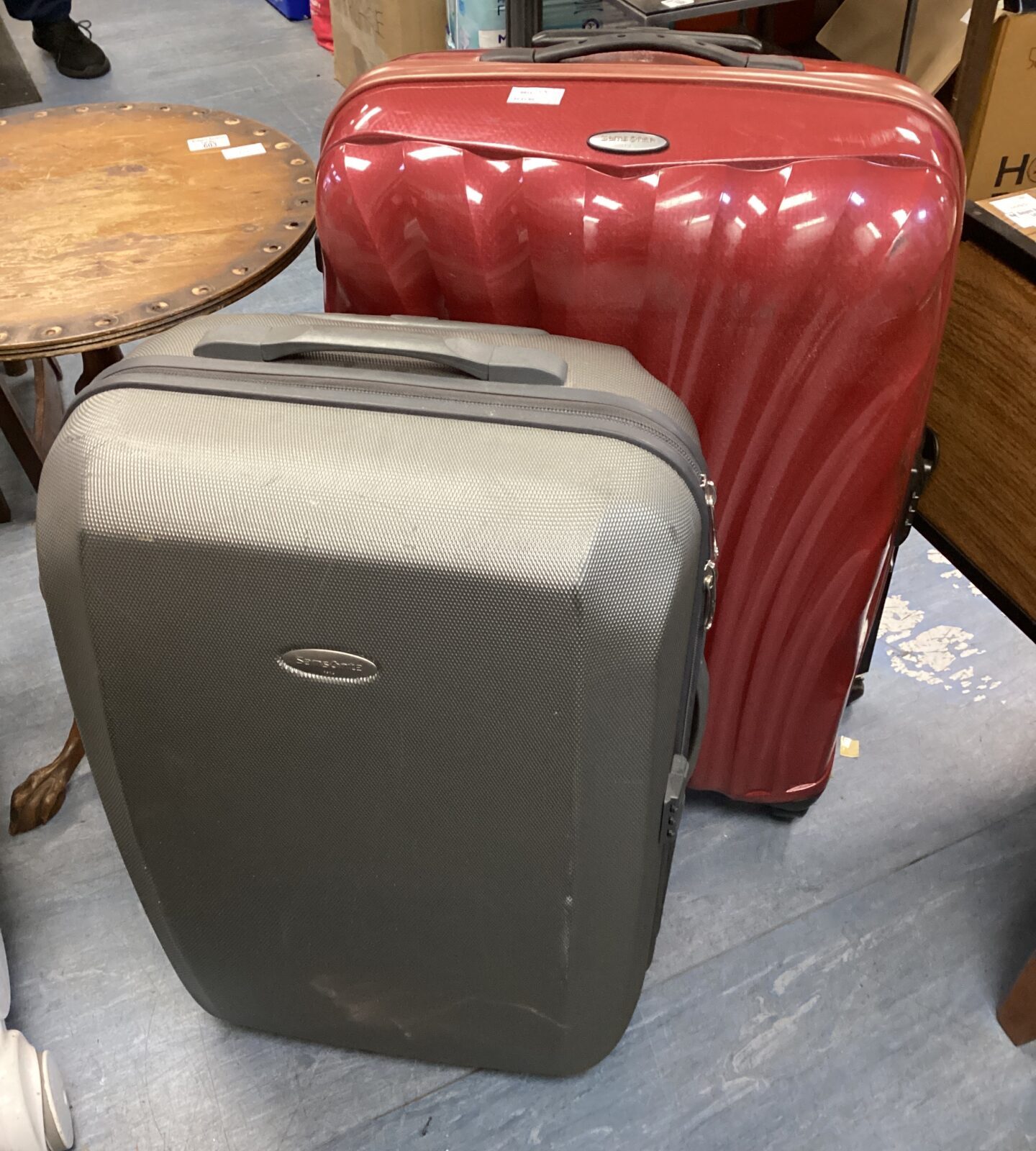 Two samsonite suitcases on wheels