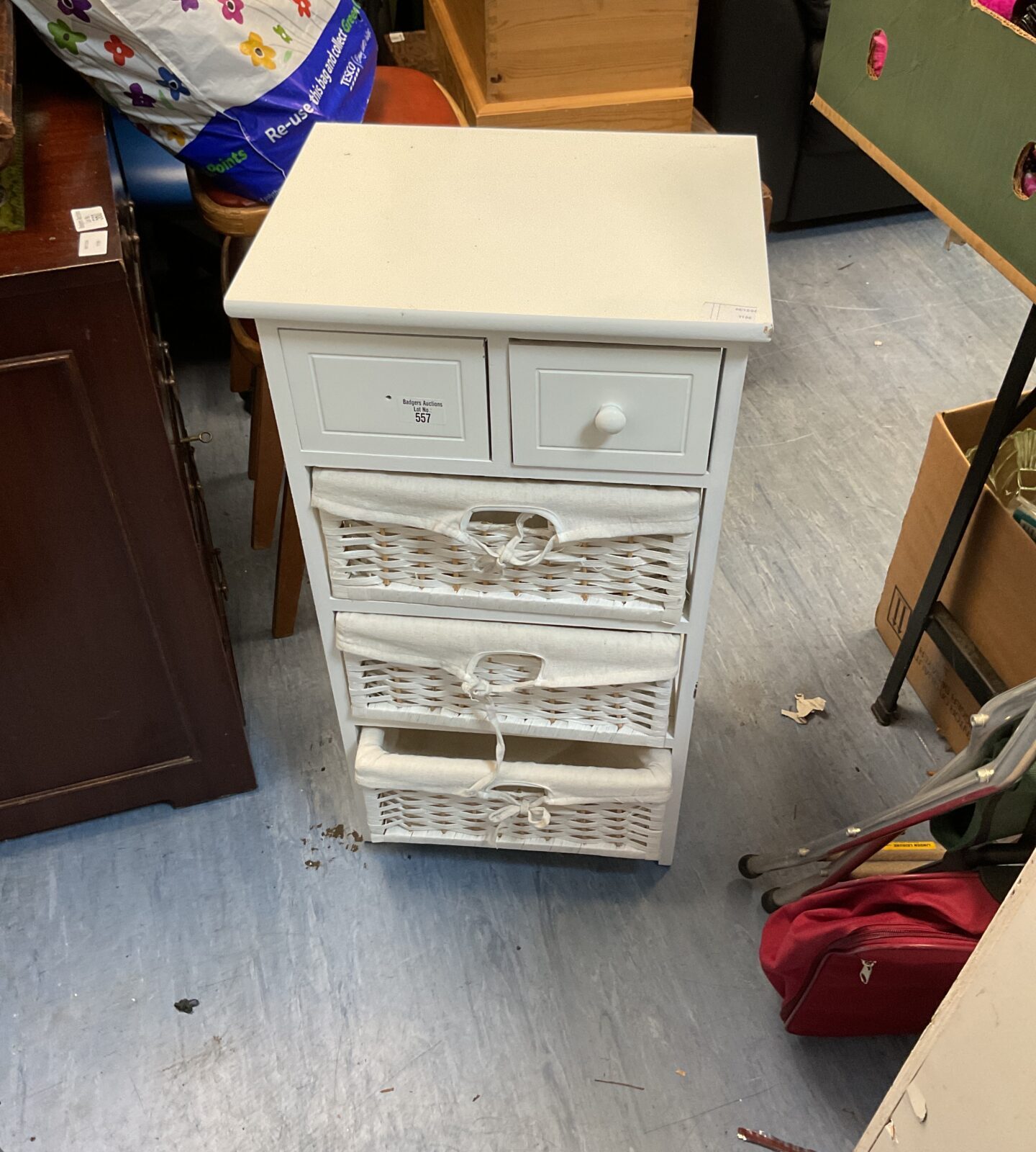 Small white storage unit with basket draws