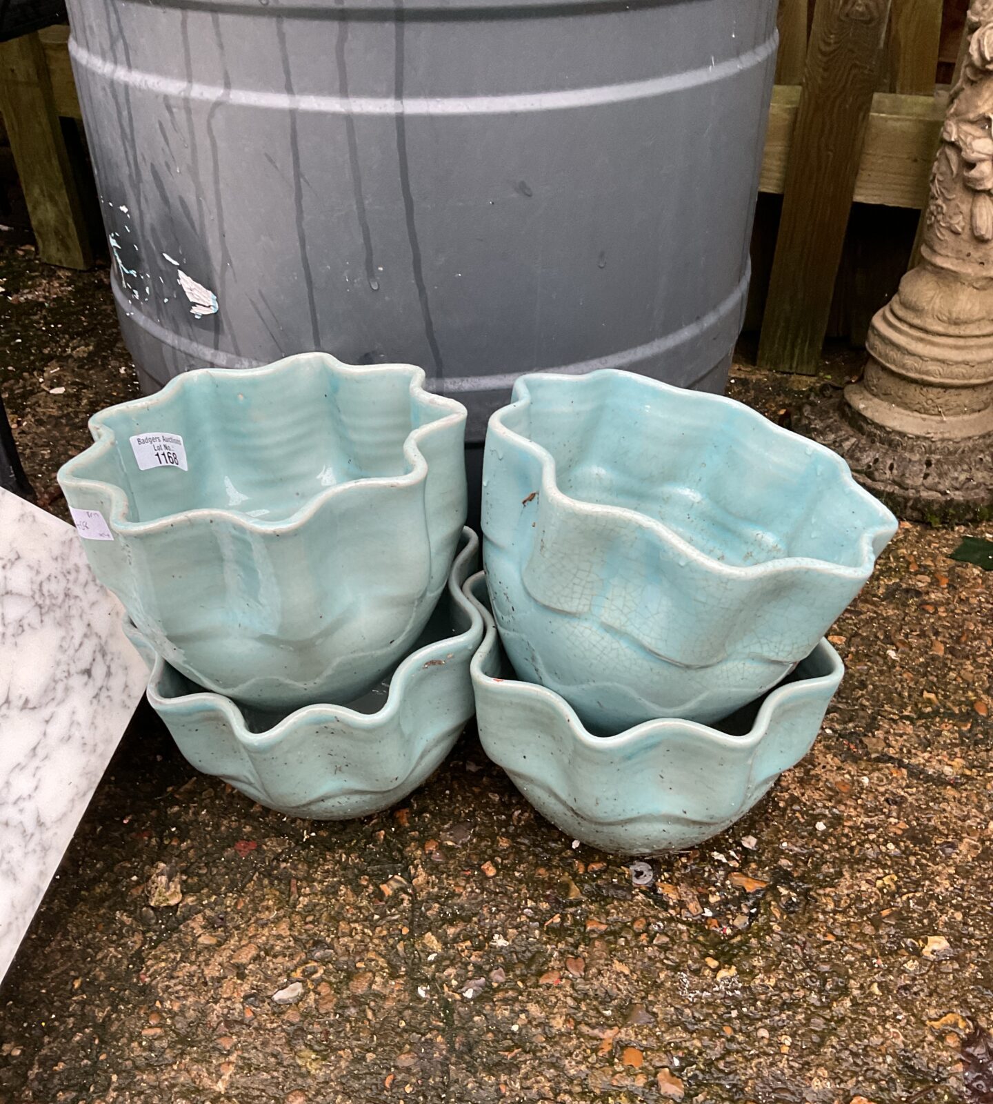 Four ruffle edged turquoise garden pots