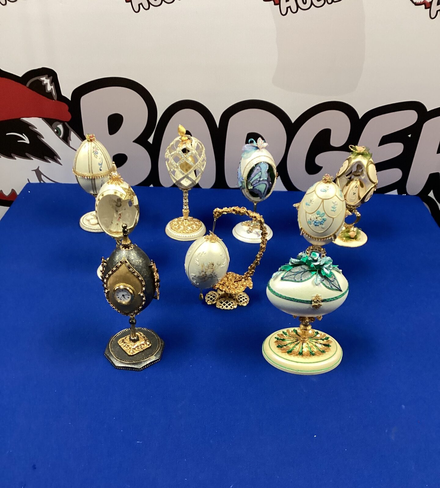 Collection of Faberge style eggs on stands