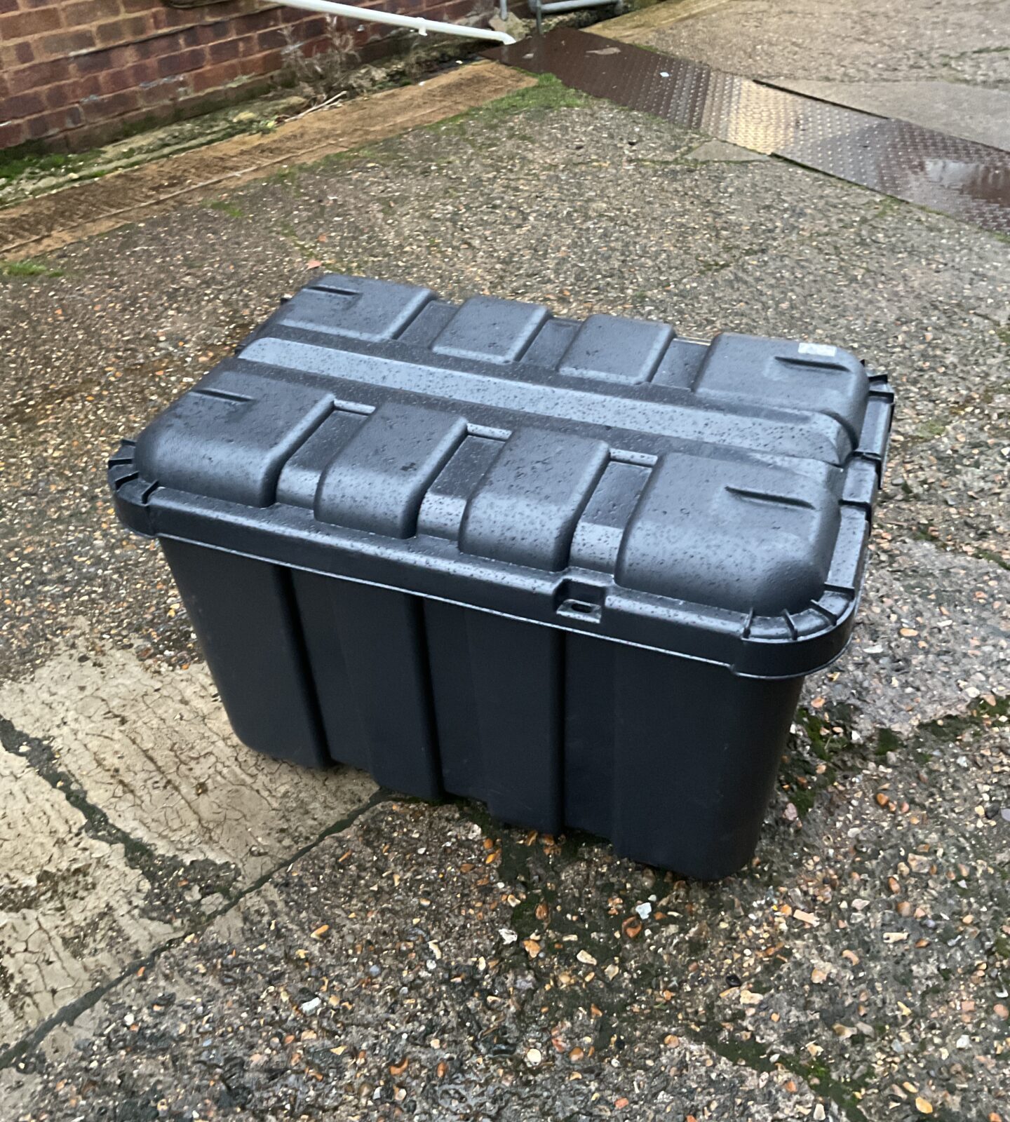 Large plastic storage box on wheels