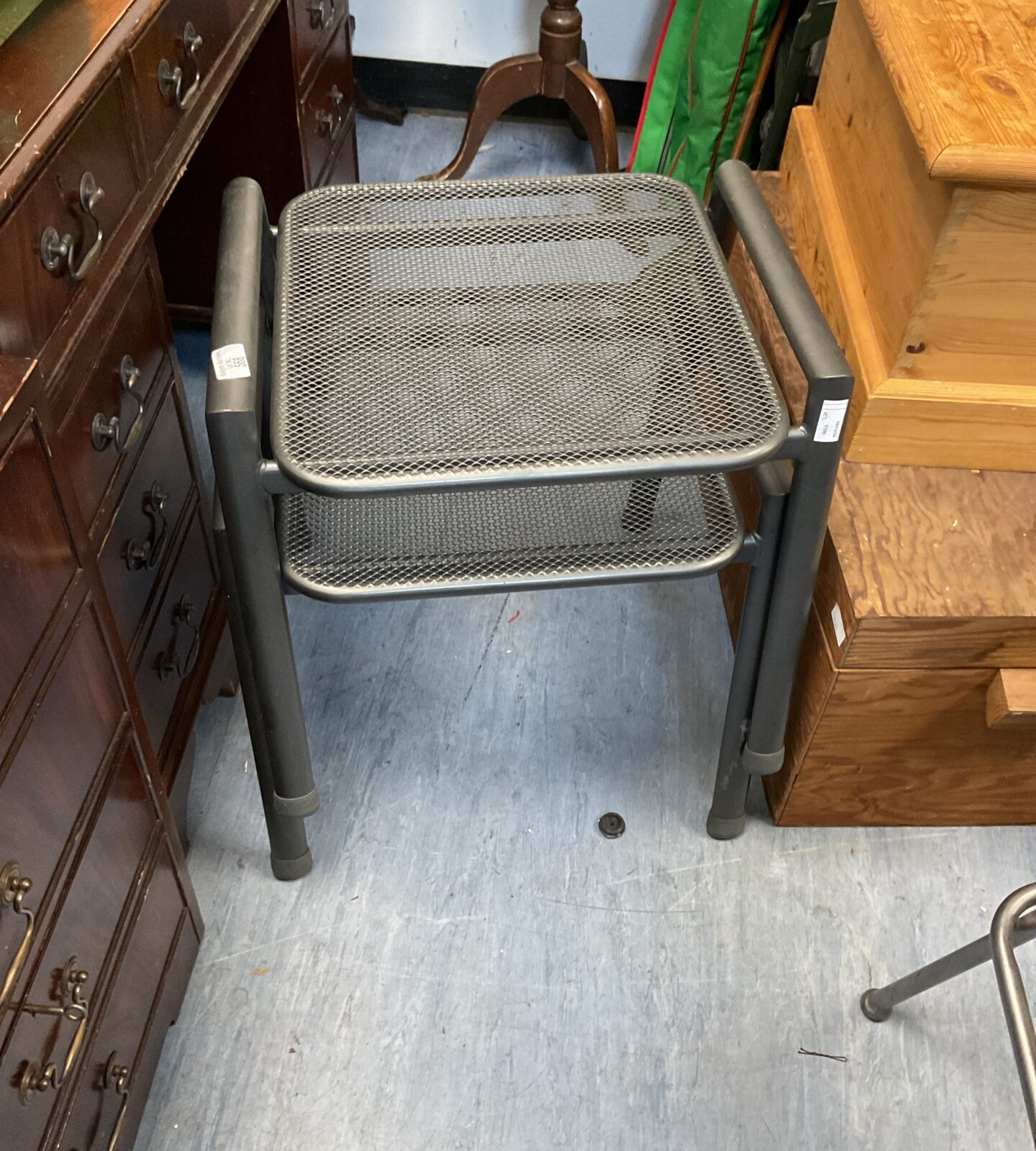 Two small metal tables