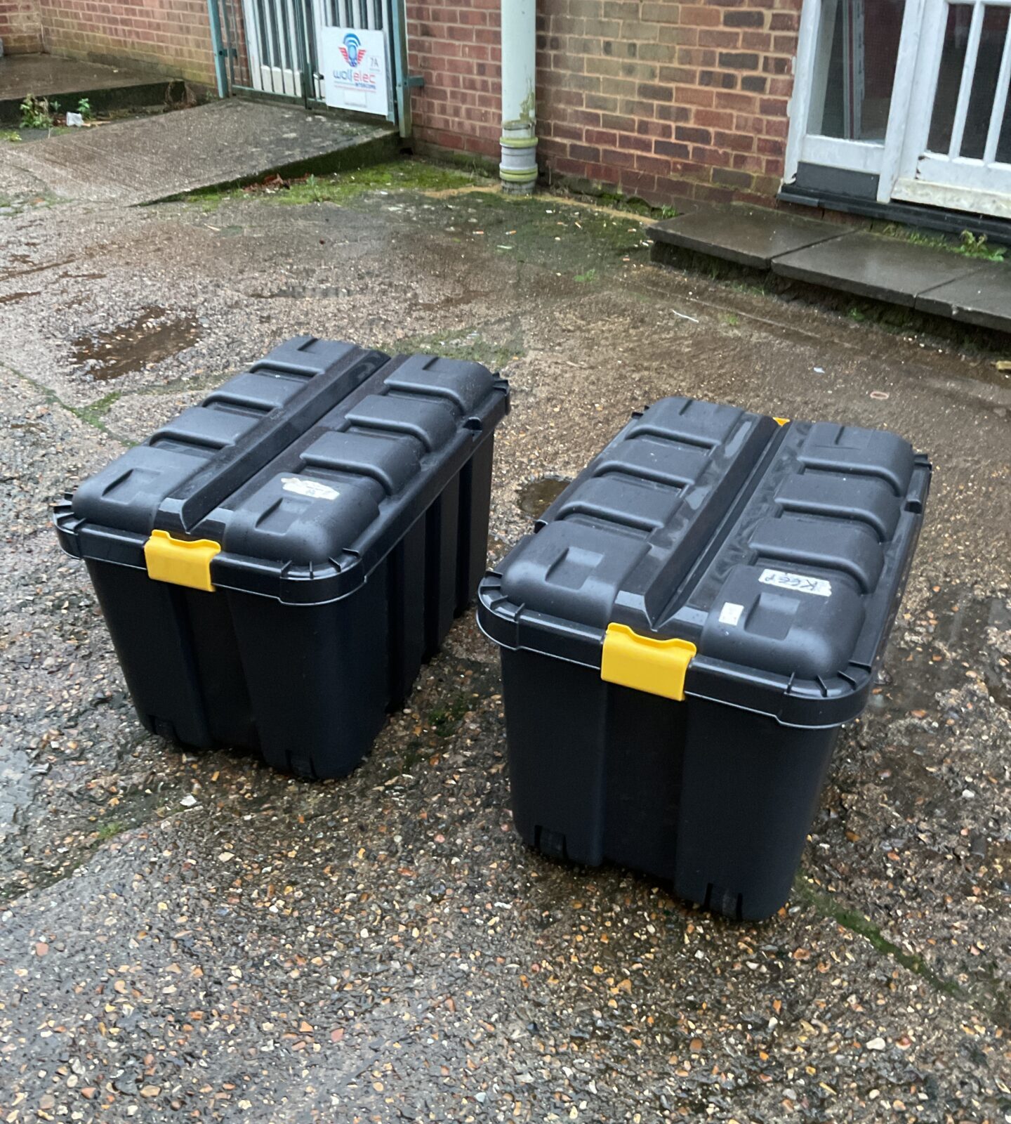 Two large storage boxes on wheels