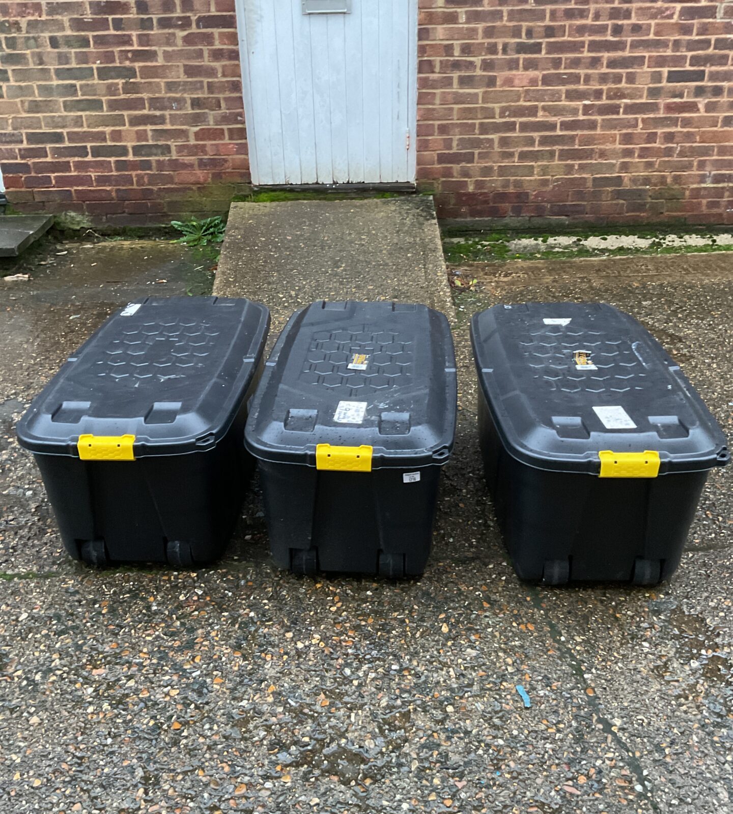 Three large storage boxes on wheels