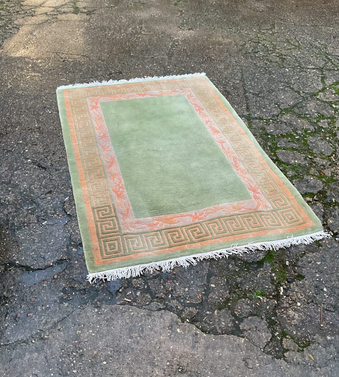 Green and orange patterned rug