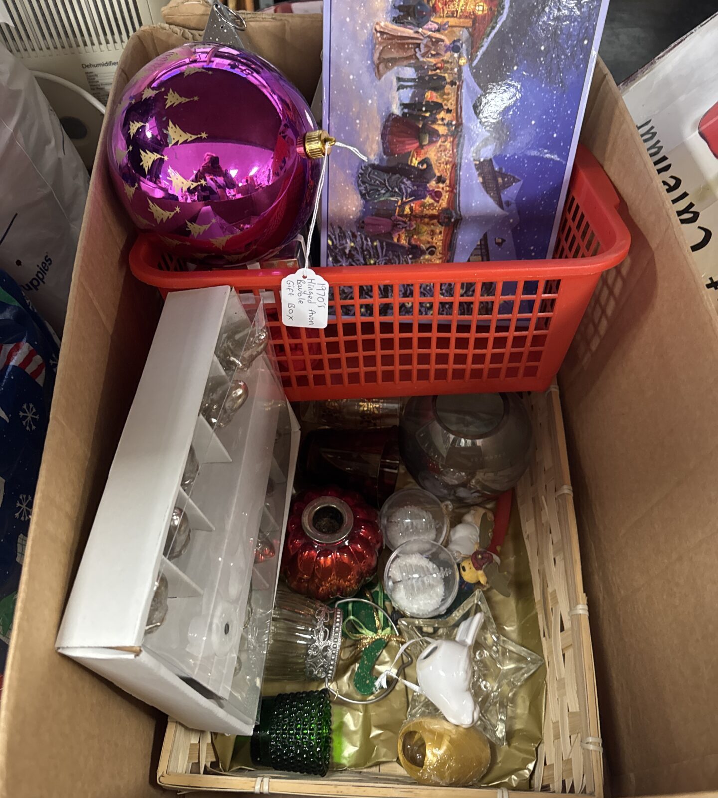 Box of mixed Christmas items inc 1970s hinged large Avon bauble