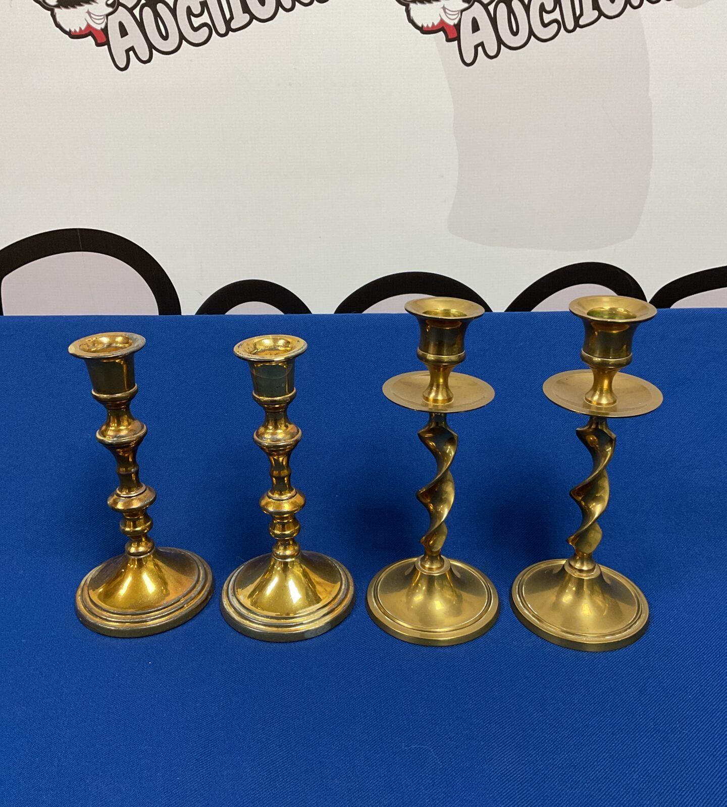 Two pairs of brass candlesticks