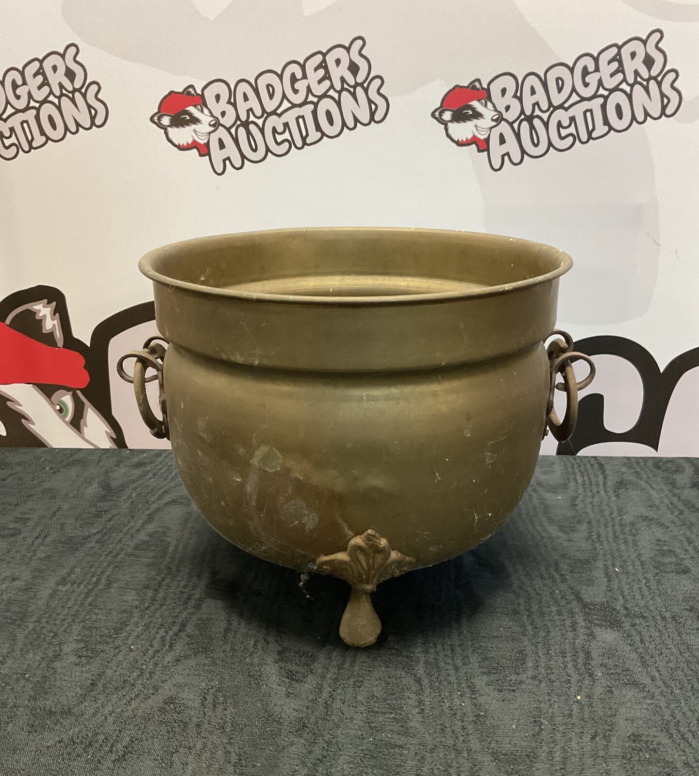 Vintage brass cauldron with clawed feet