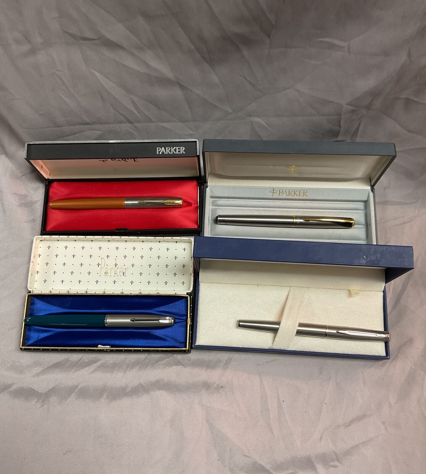 Three Parker fountain pens and a waterman fountain pen