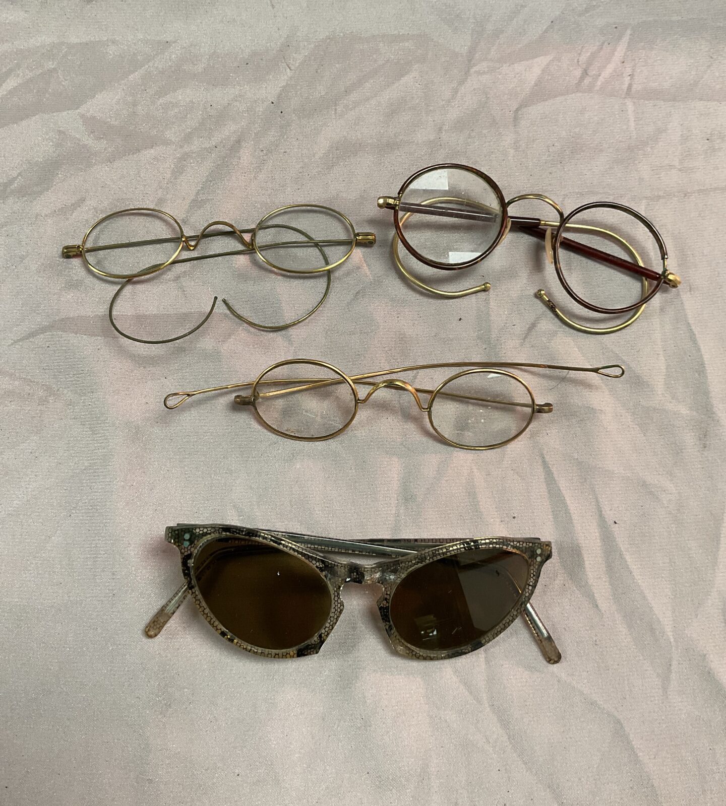 Three pairs vintage glasses and a pair of sunglasses