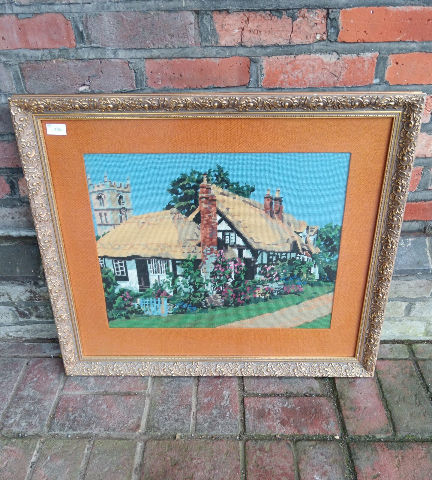 Large gilt framed tapestry of a thatched cottage