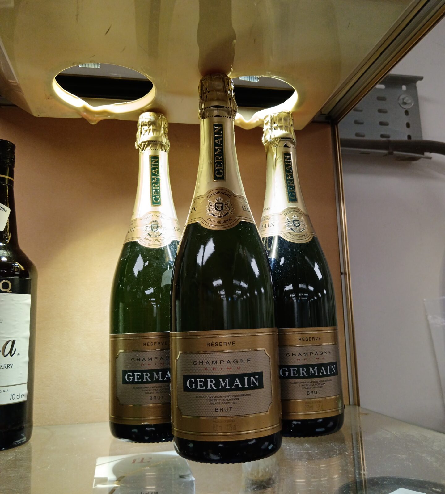 Three bottles of Germaine champagne brut