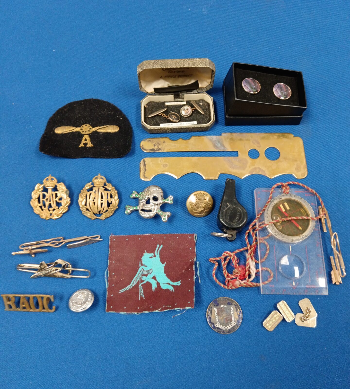 Tub of mixed military related items including badges