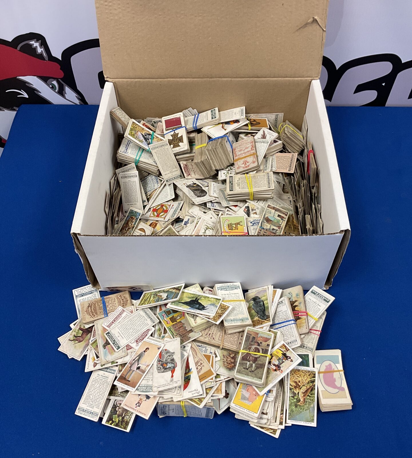 Box full of vintage john players cigarette cards