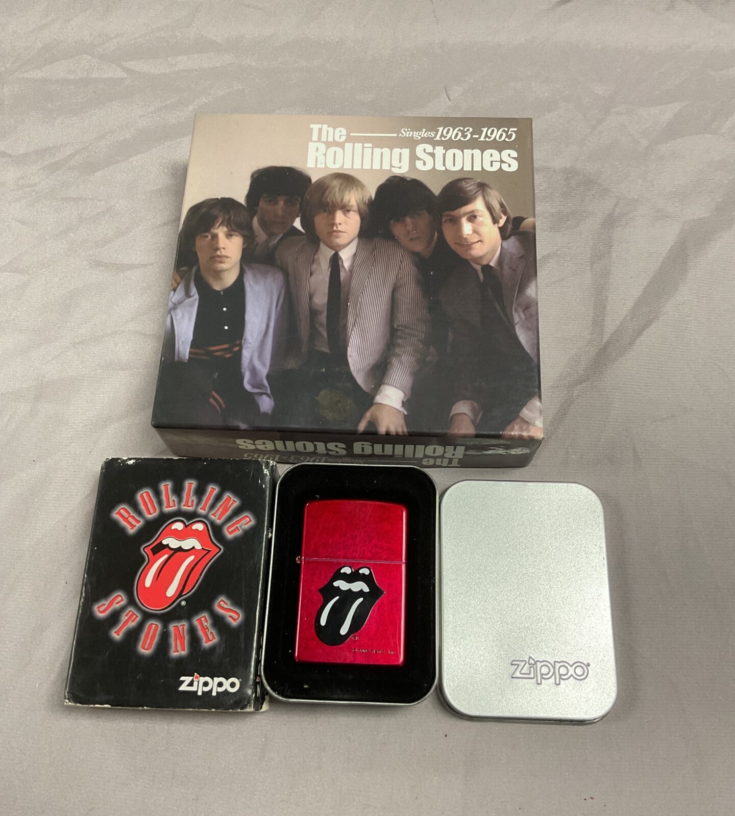 Boxed Rolling Stones cd set and zippo Lighter