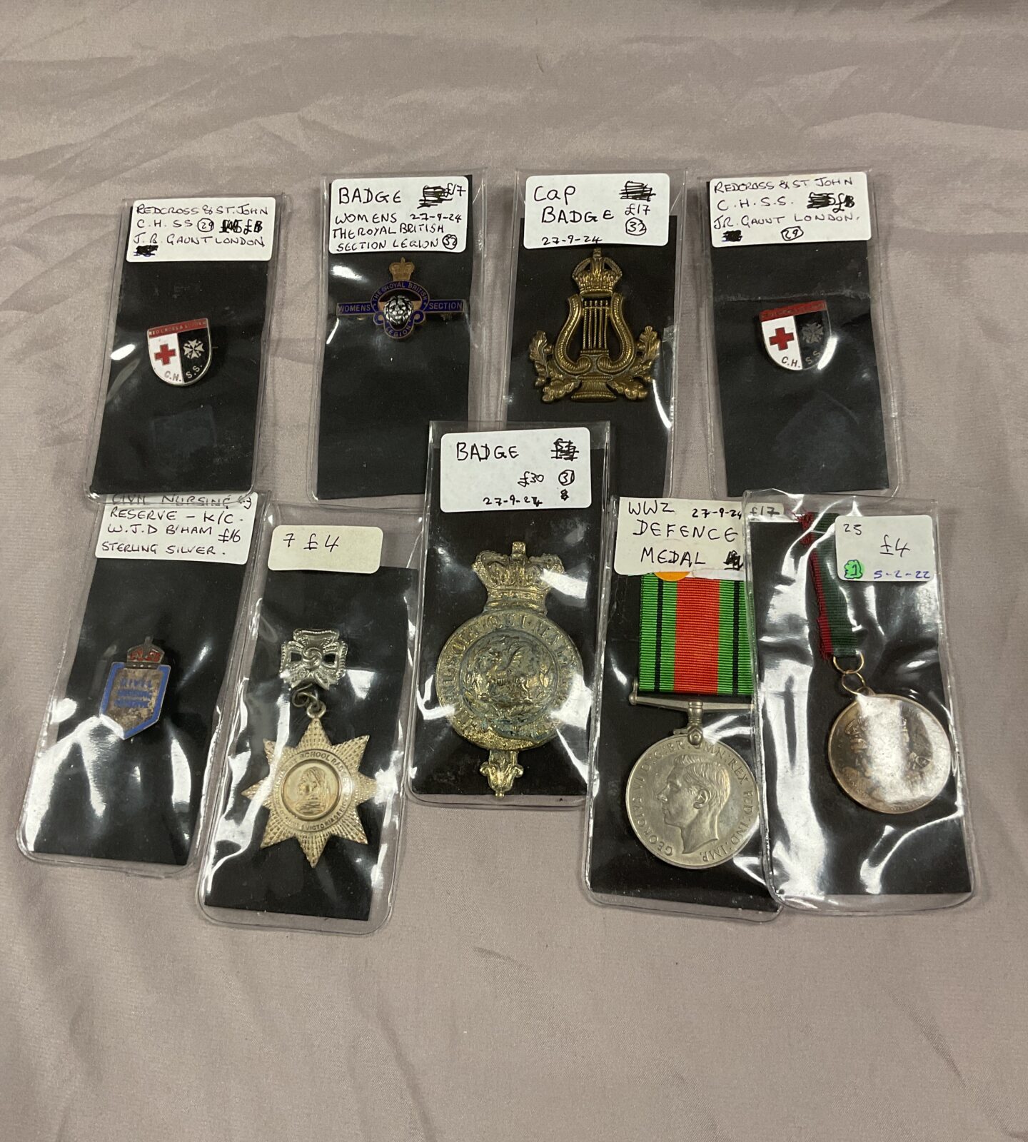 Collection of medals and enamel badges