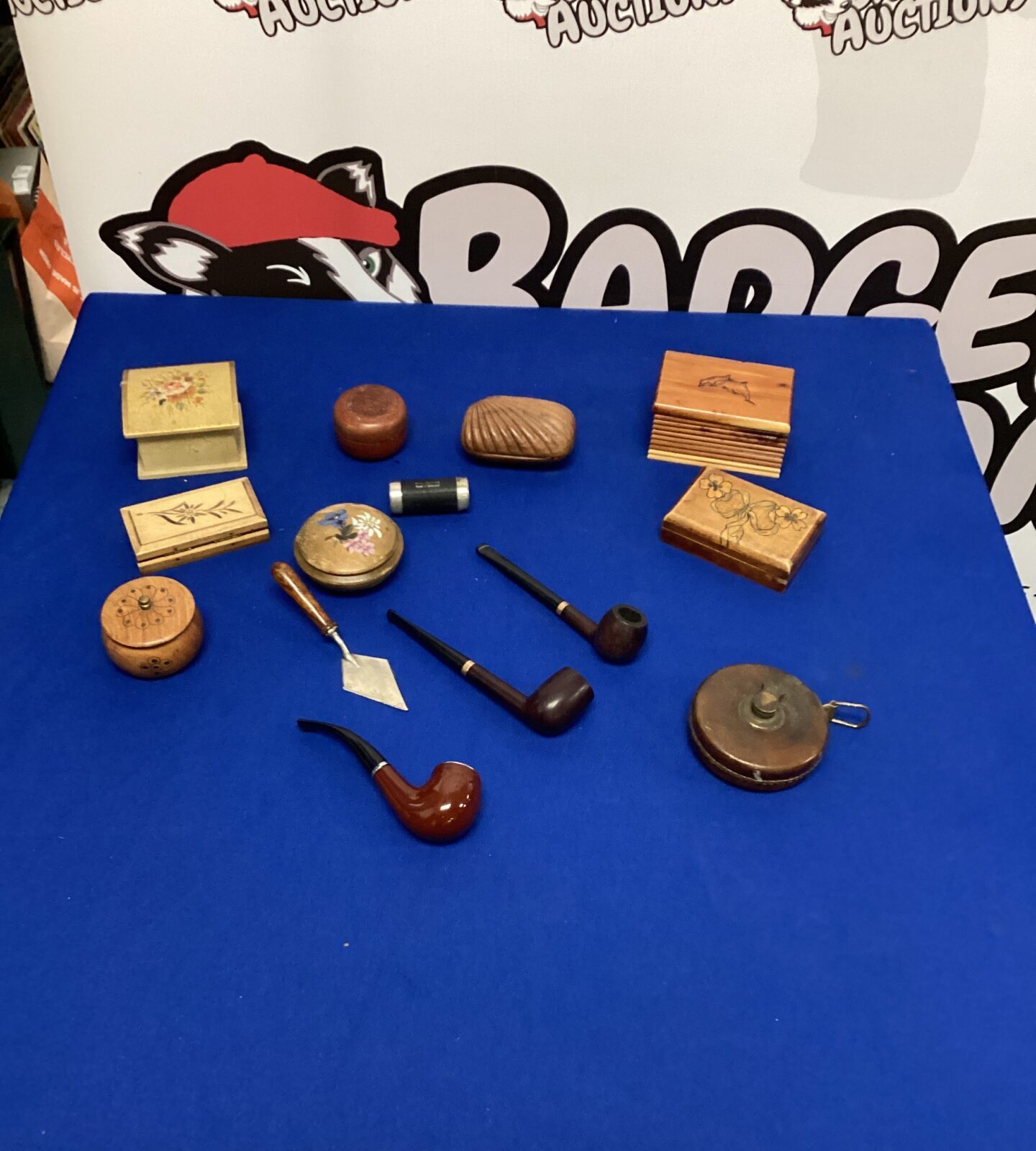 Collection of wooden trinket boxes, pipes and vintage tape measure