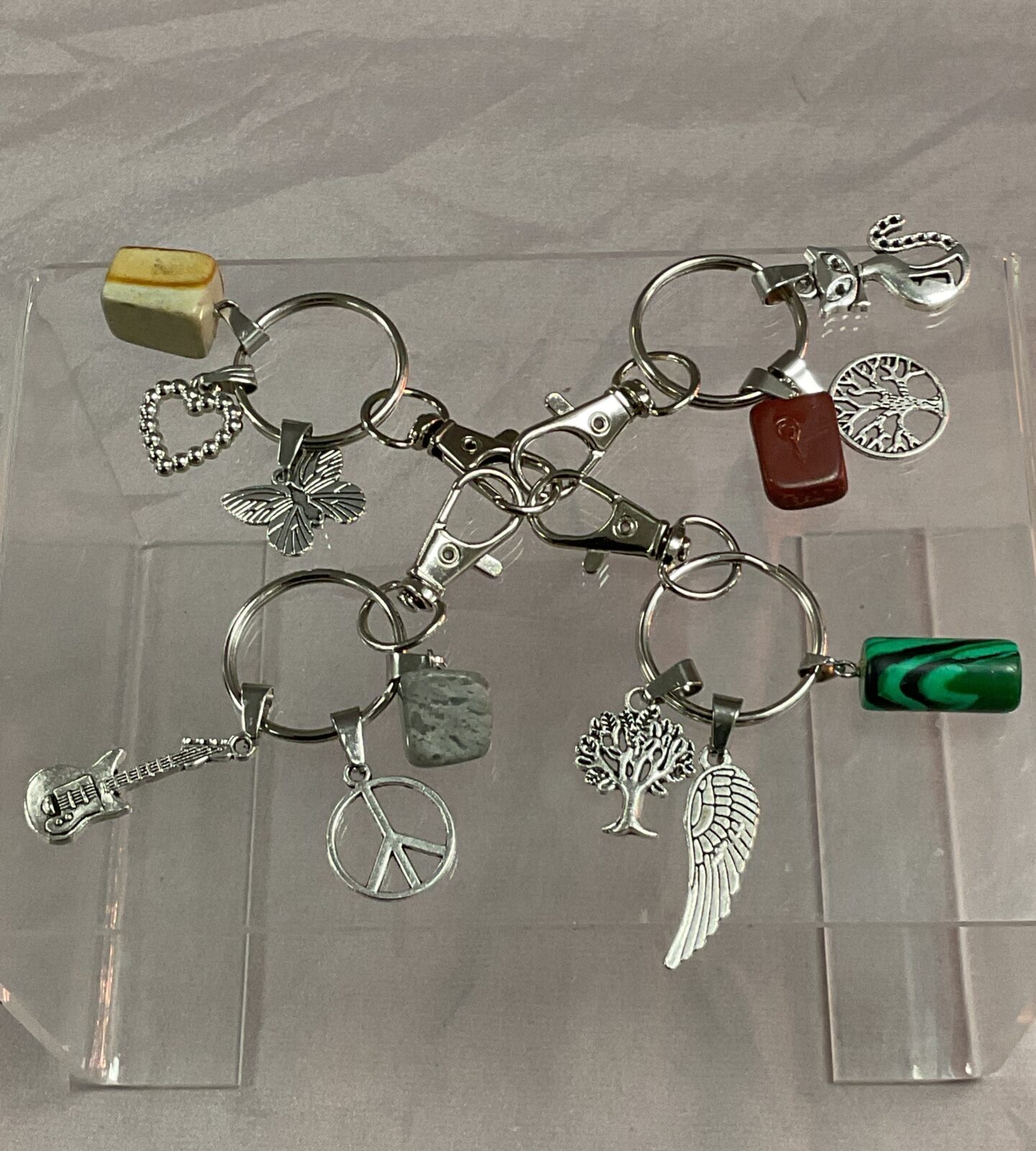 Four crystal and charm  keyrings