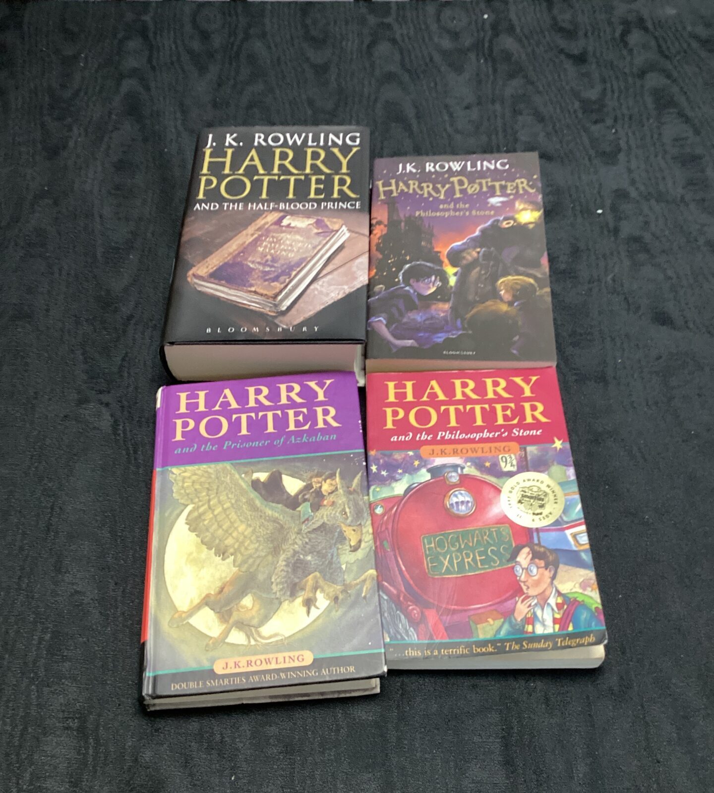 Four harry potter books inc philosophers stone, the prisoner of azkaban & half blood prince