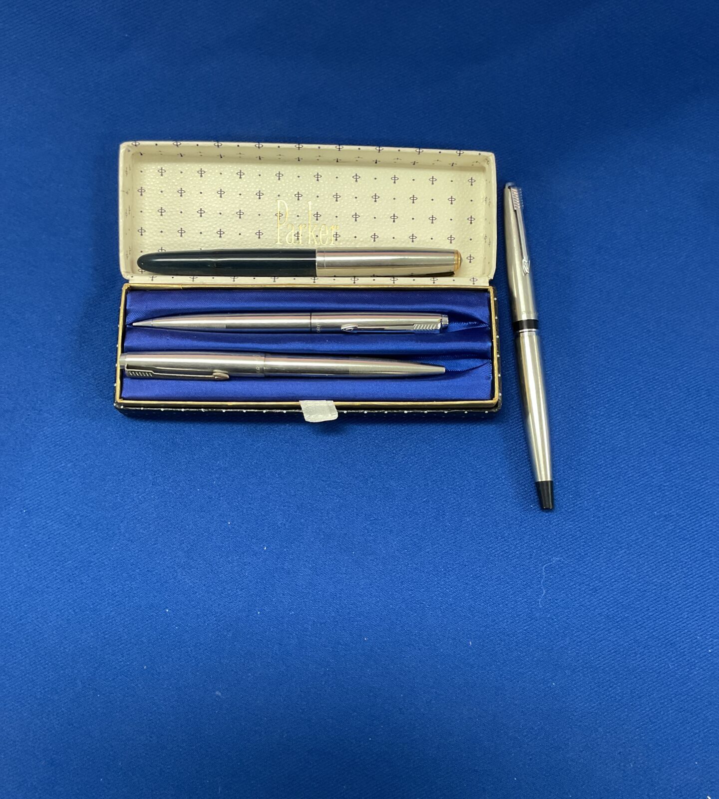 Four parker pens in case