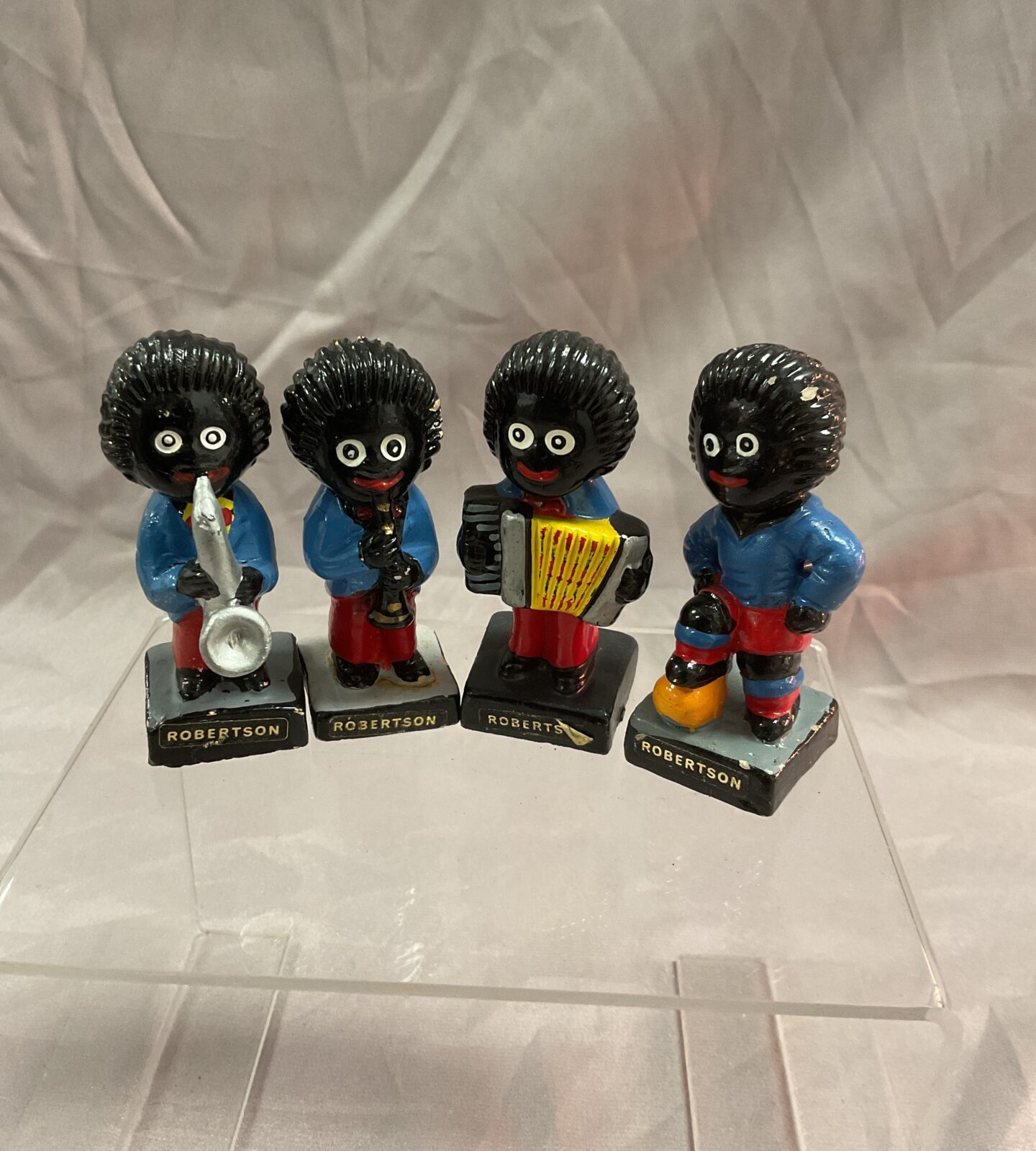 Four Robertson gollies band figures