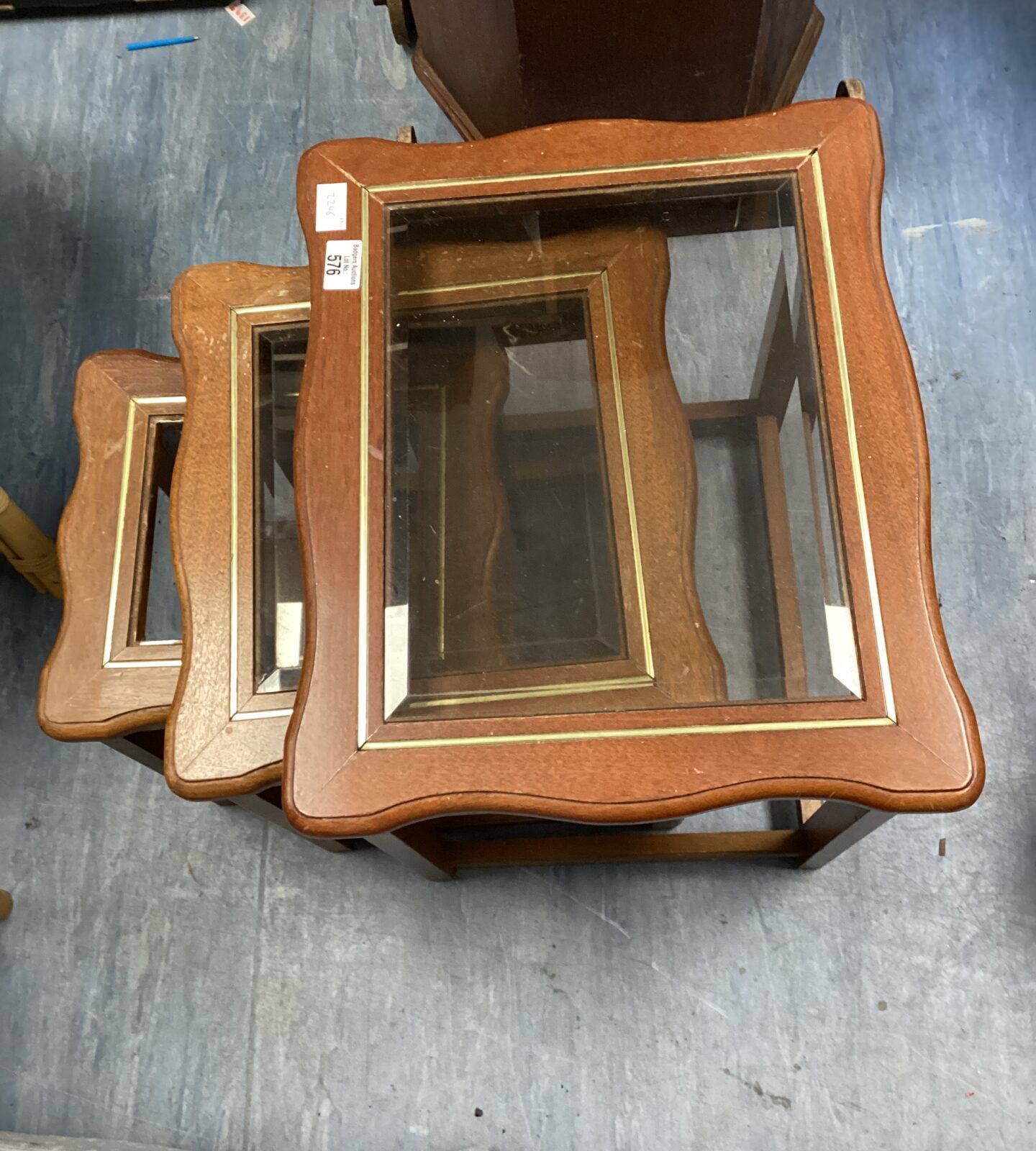 glass topped nest of tables (missing glass on smallest table )