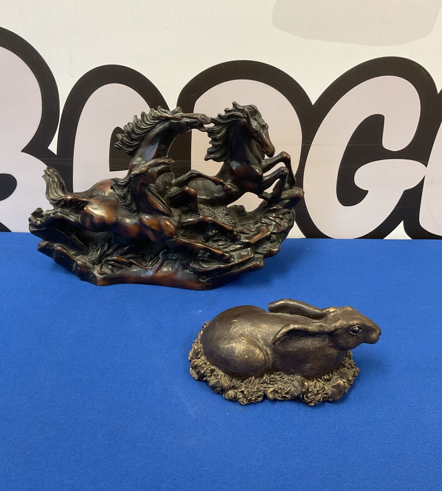 Two bronzed resin animal sculptures including horses