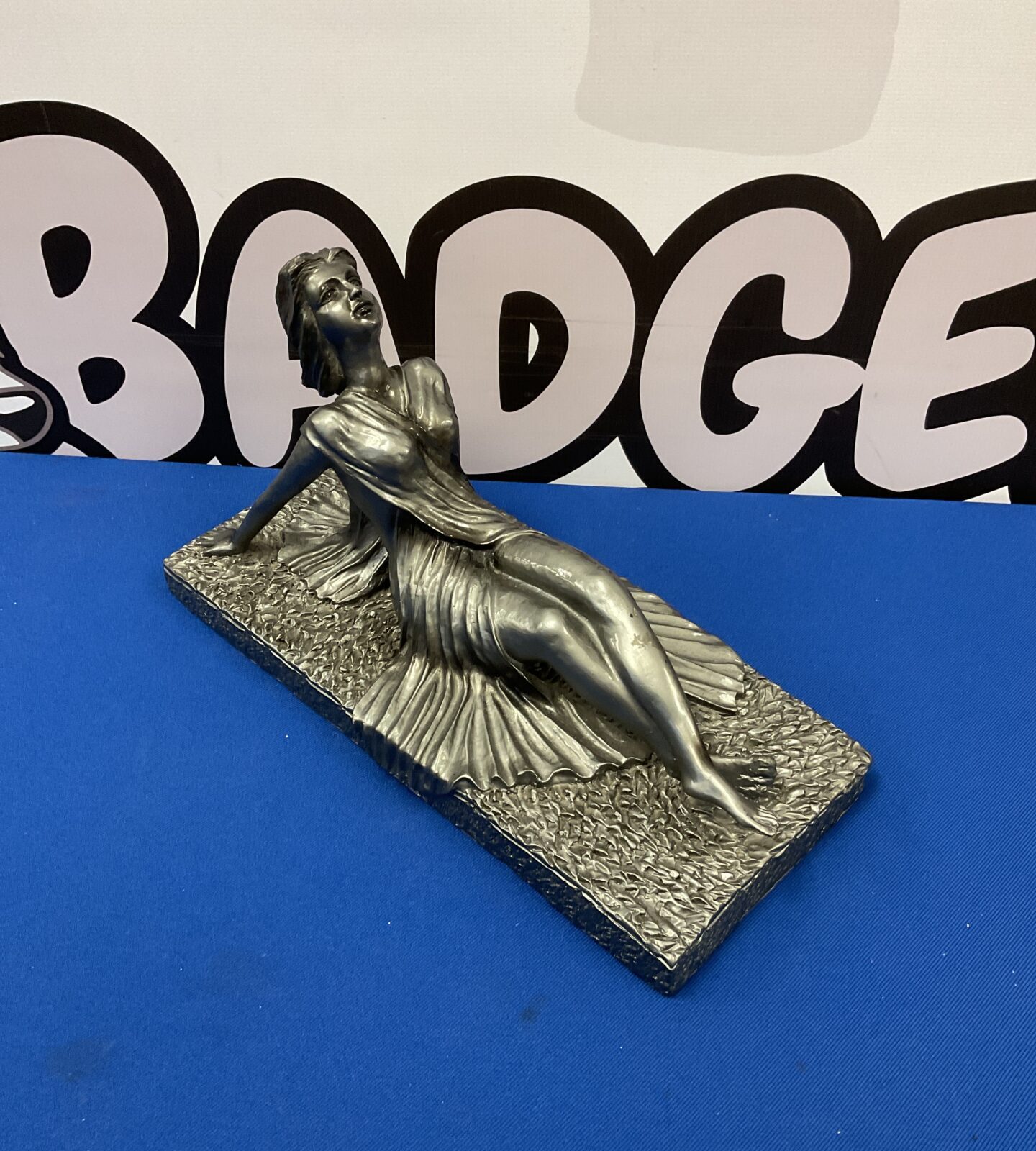 Resin sculpture of a reclining art deco lady