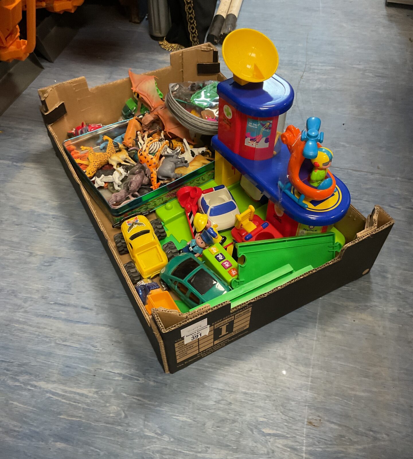 Box of childrens toys and farm animals