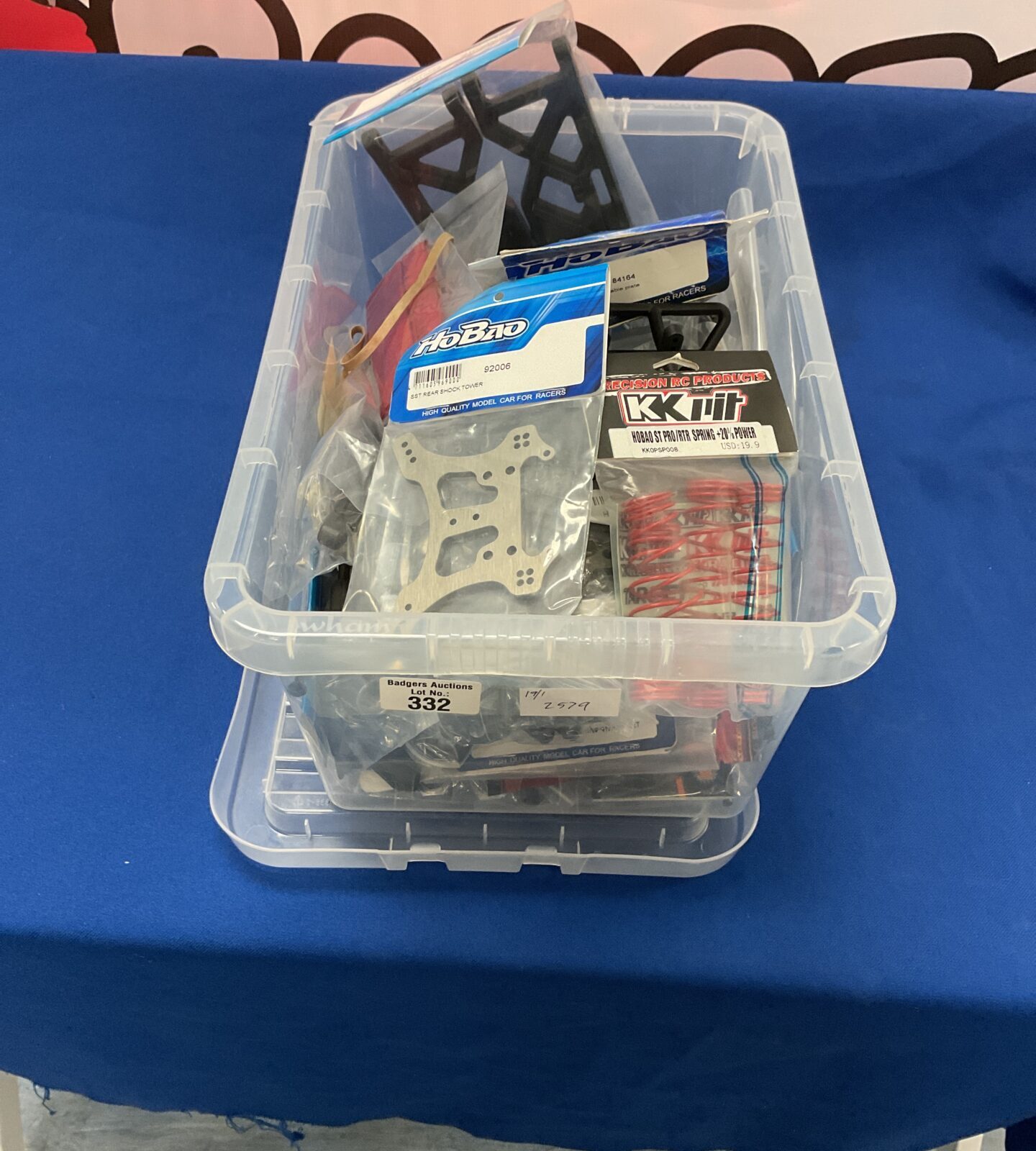 Box of radio controlled car model components and parts new