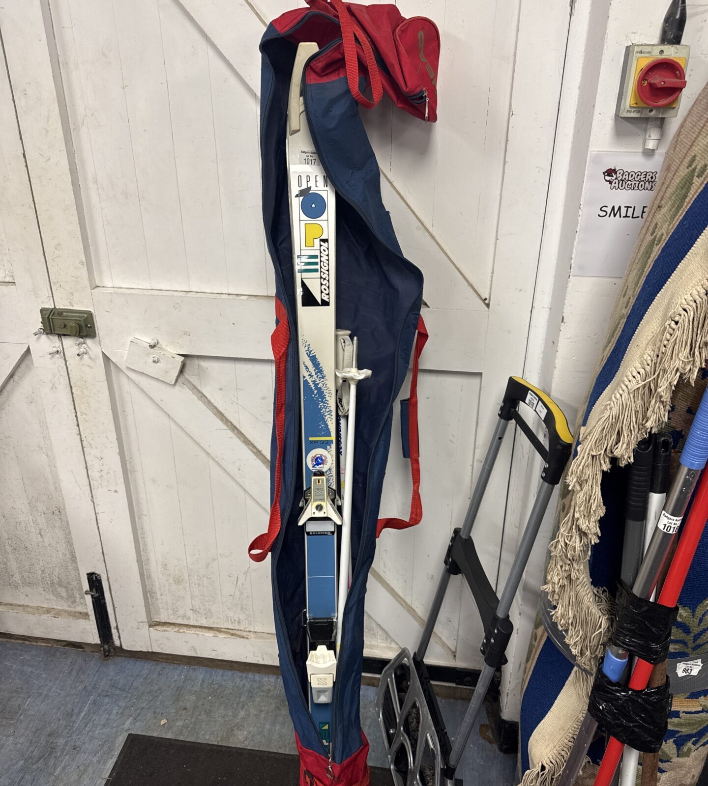 Pair of rossignol open xp33 skis with poles