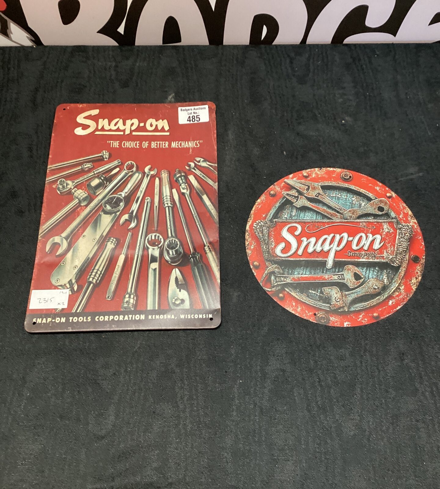 Two snap on metal signs