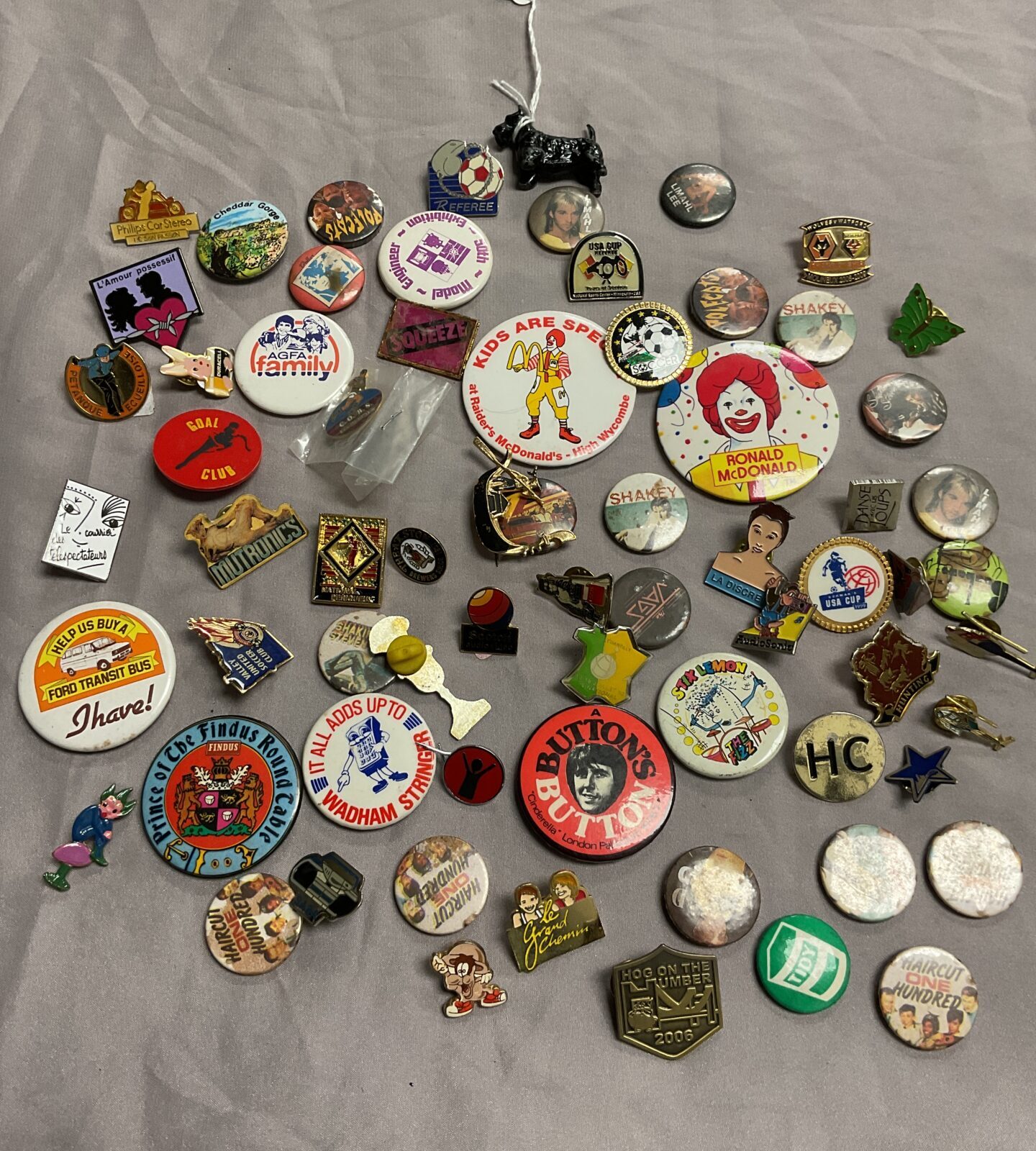 collection of badges music and advertising plus cold painted scottie dog