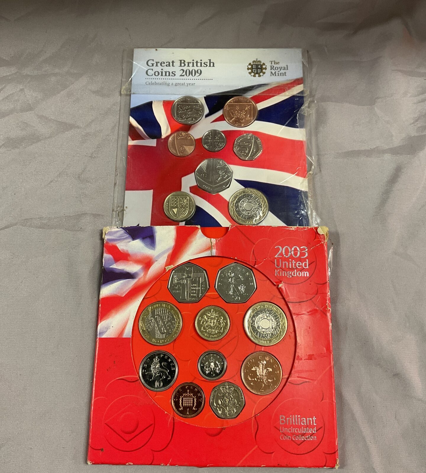 Two Brilliant uncirculated United Kingdom coin collections 2003 and 2009