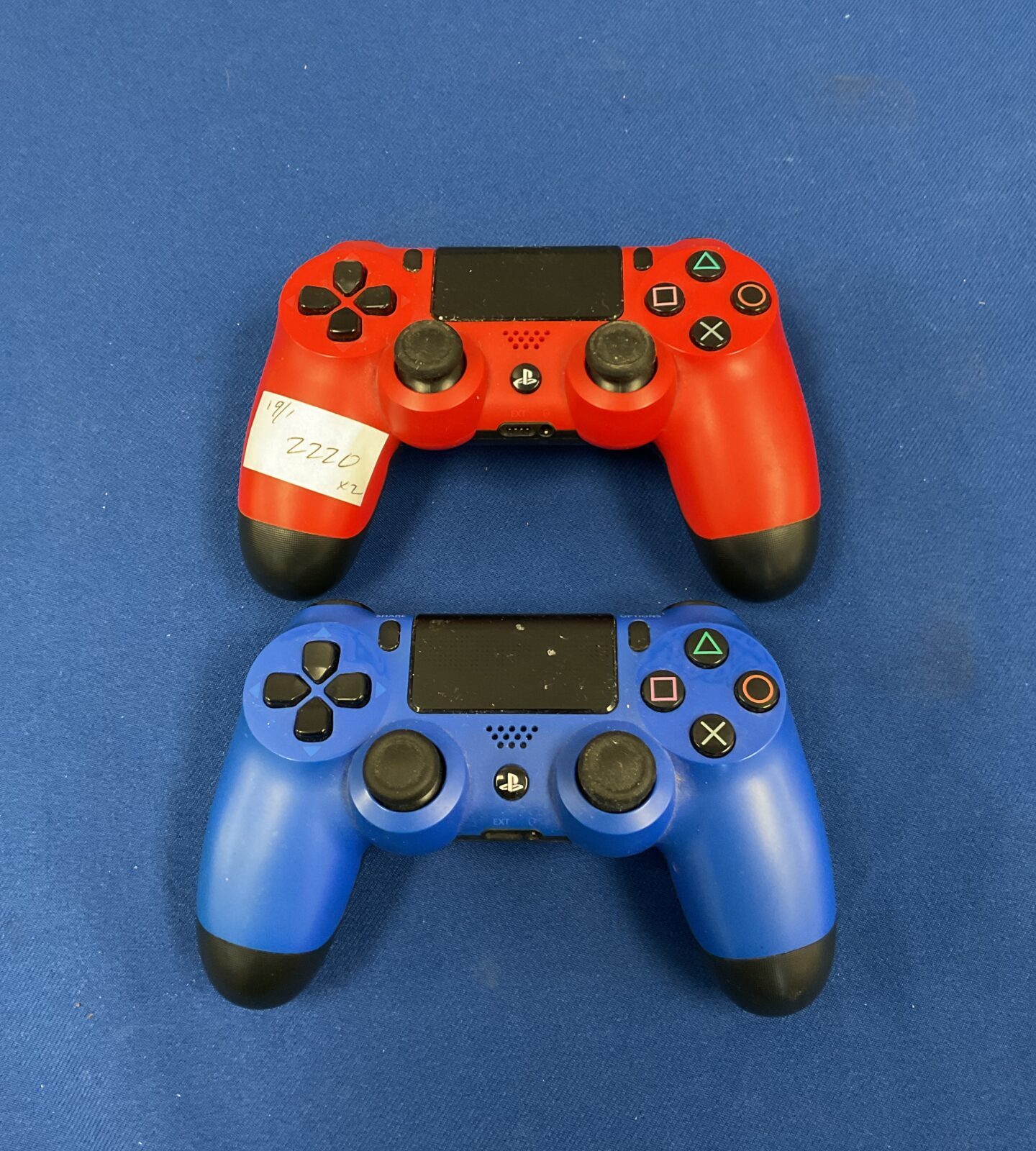 Two Sony PlayStation 4 controllers