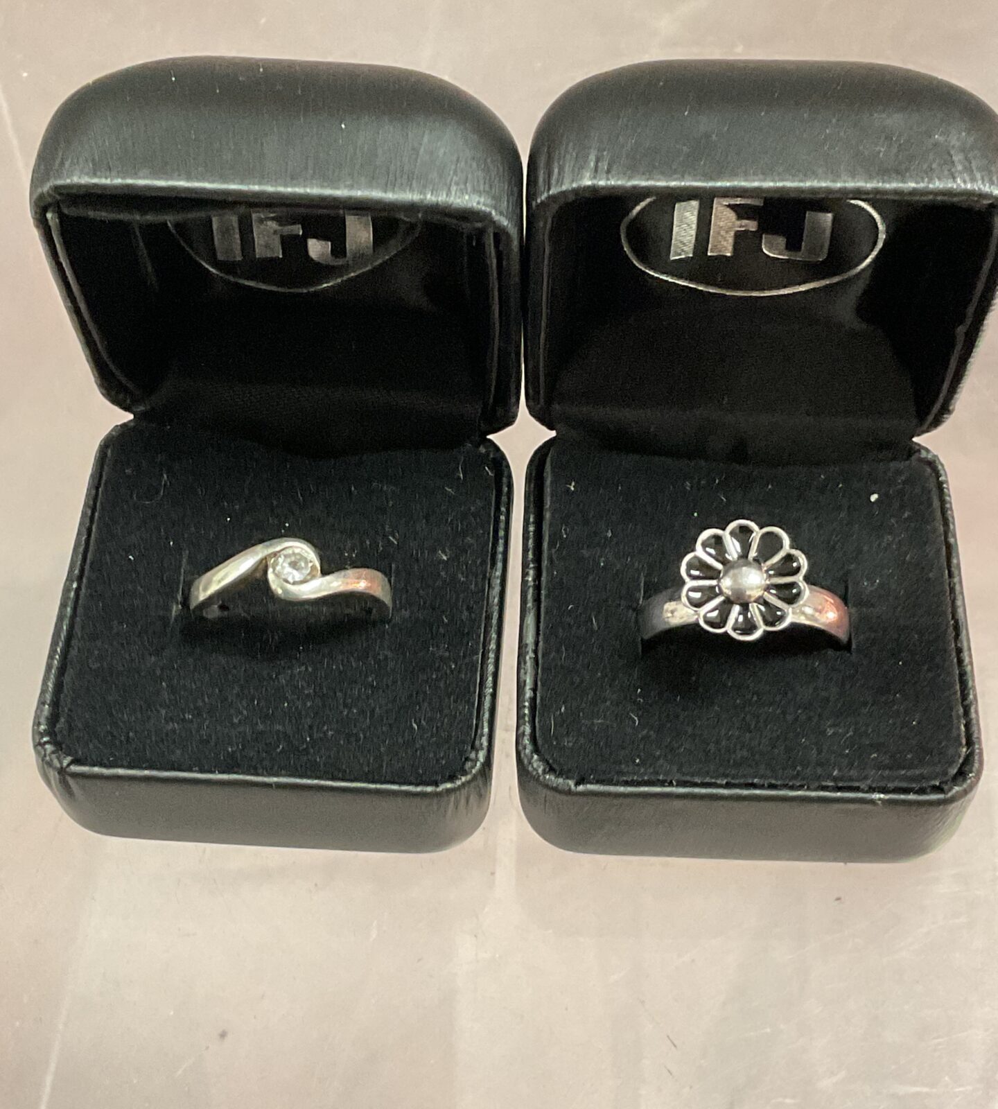 Two 925 Silver rings sizes K M