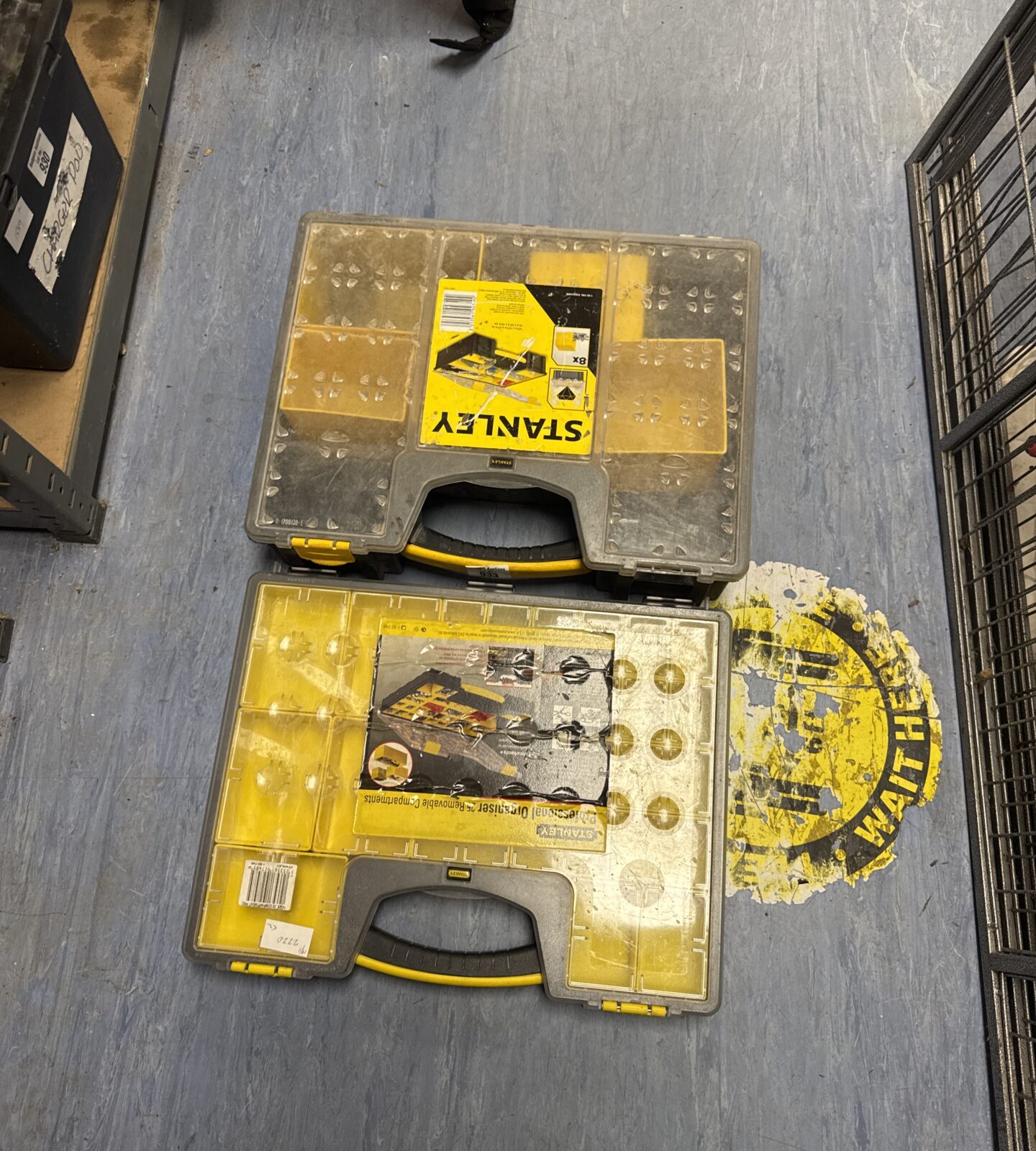 Two Stanley storage trays - one missing a couple of compartment trays