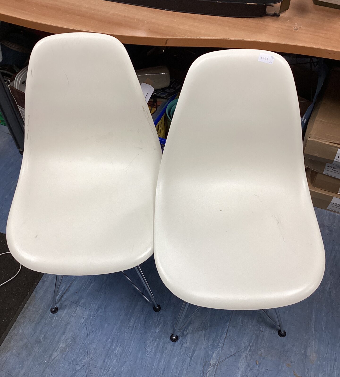 two white charles eames designer style chairs