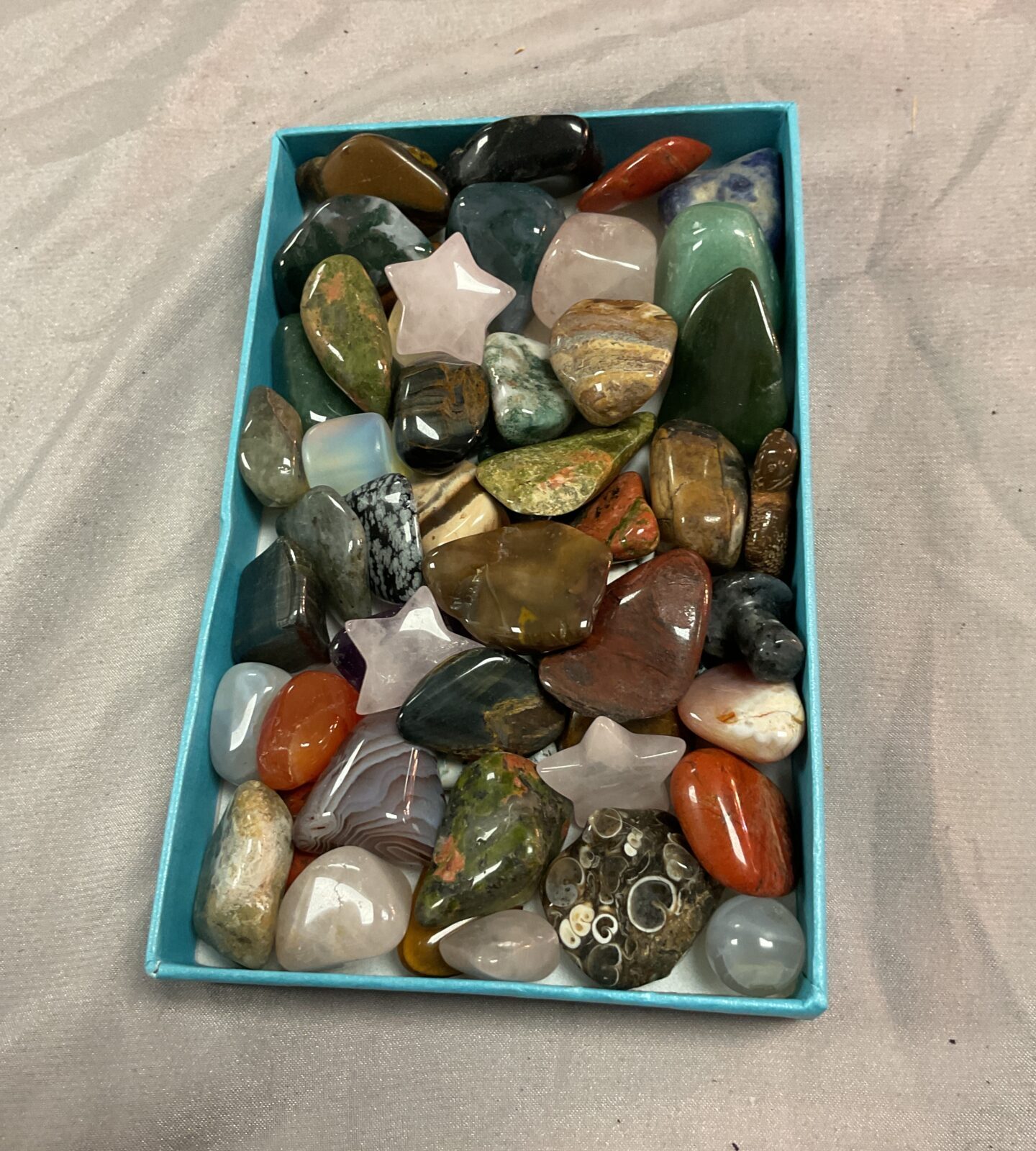 Box of assorted polished stones